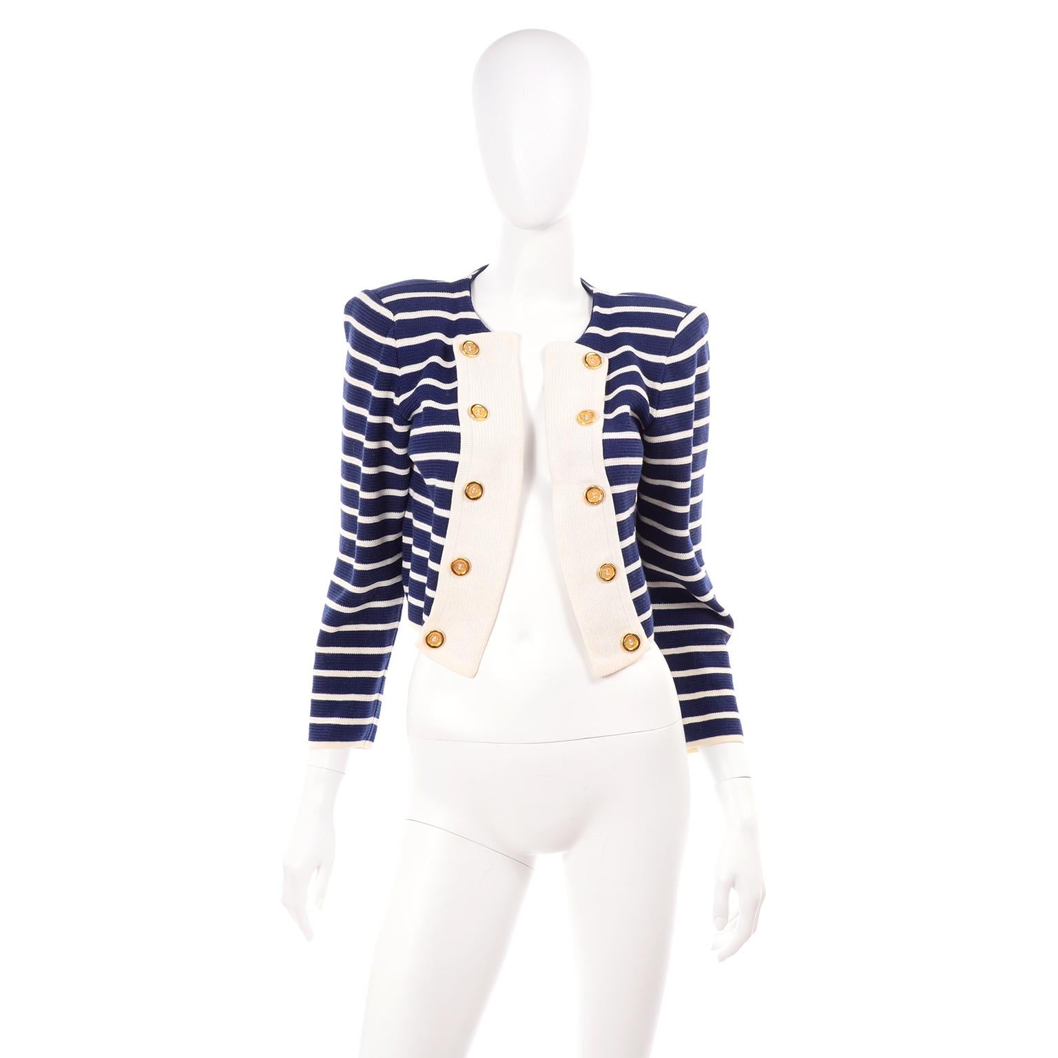 This vintage Yves Saint Laurent navy blue and white striped jacket is open in the front with pretty gold decorative metal buttons.  This YSL 100% cotton knit jacket is perfectly cropped and has shoulder pads for structure. The perfect summer jacket