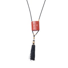 Yves Saint Laurent, collier vintage en corde à breloques en opium avec pompon, années 1980