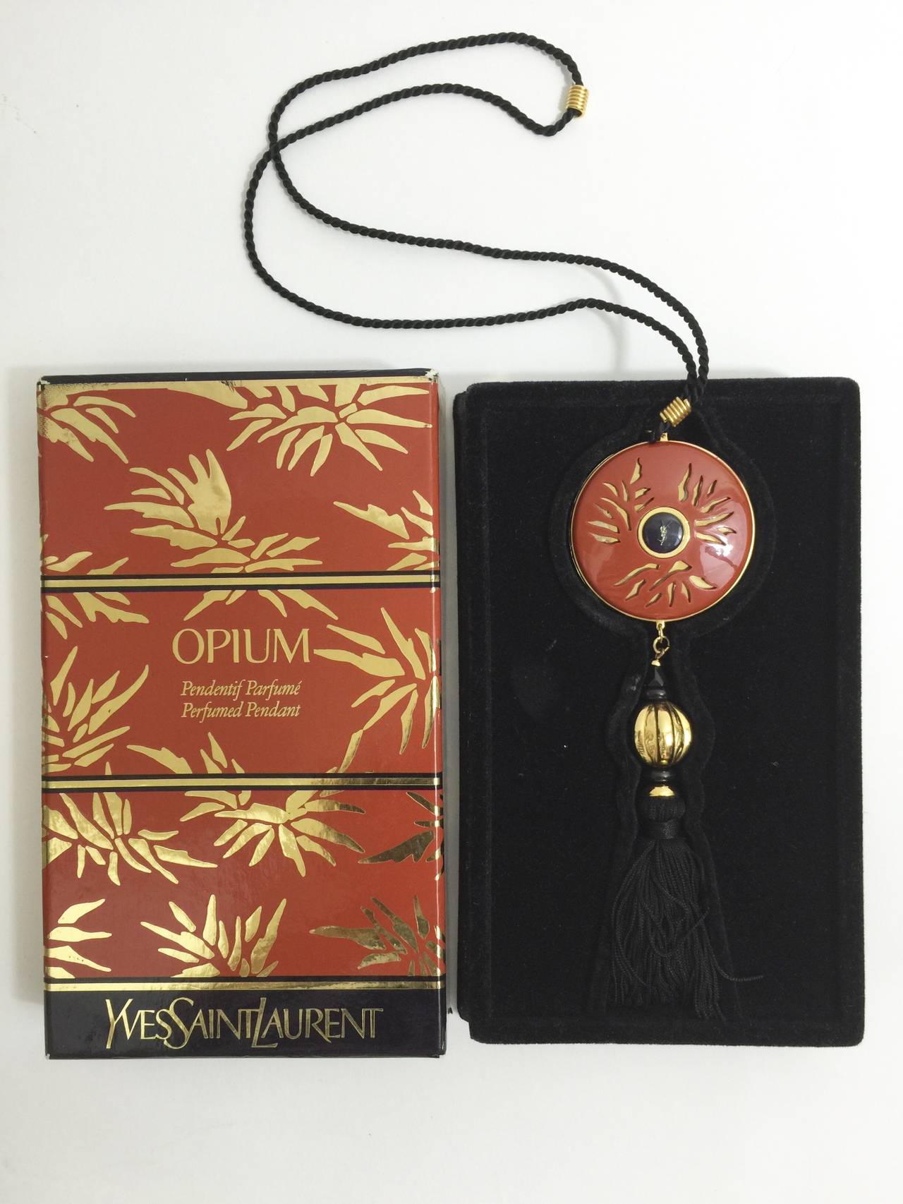 Women's Yves Saint Laurent Vintage Opium Pendant & Gold Bead Black Tassel Necklace For Sale