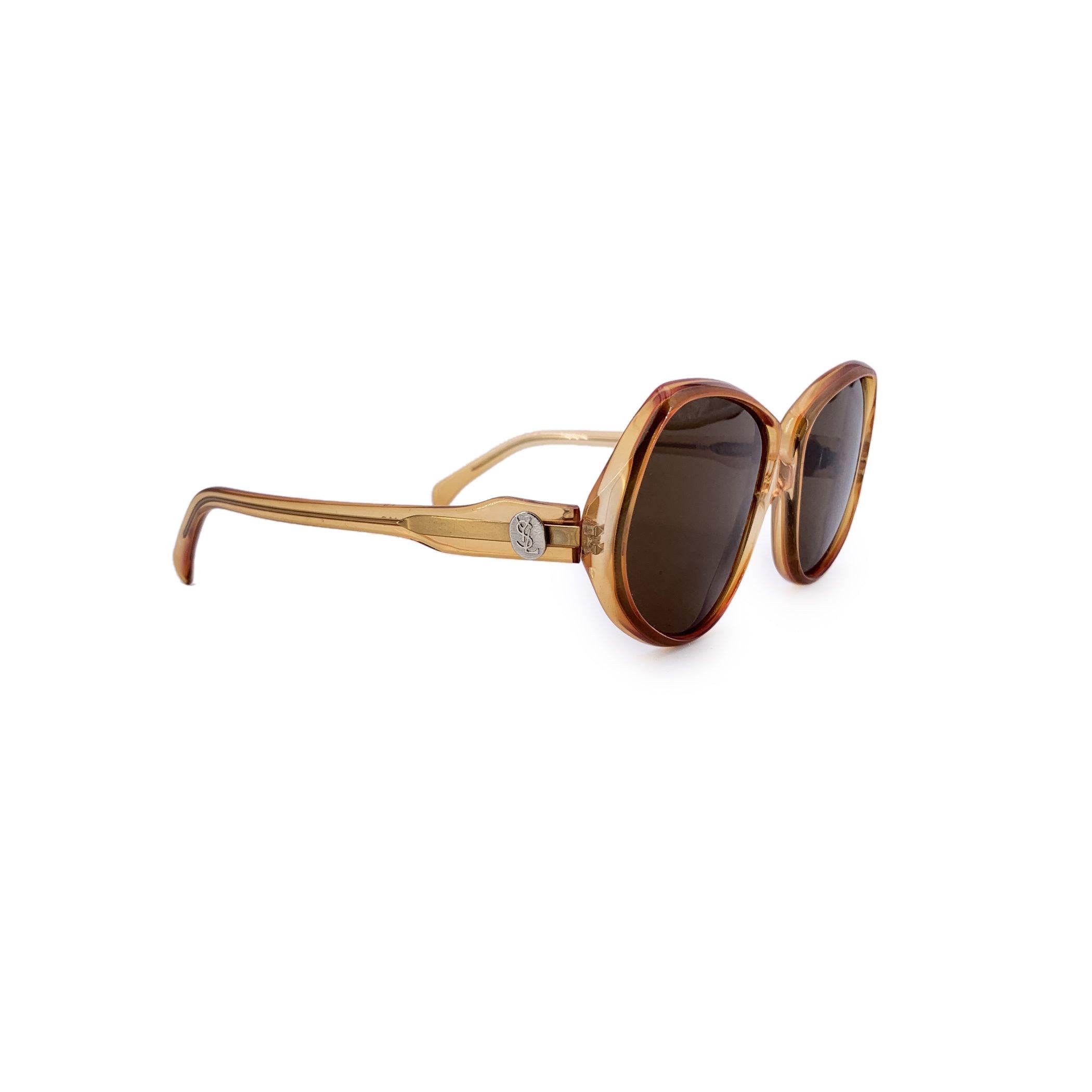 A timeless piece from the golden era of designer eyewear, these vintage Yves Saint Laurent sunglasses, model Delias (50/18), offer understated elegance with a distinctly French touch. Made in France, the frame features a warm, classic