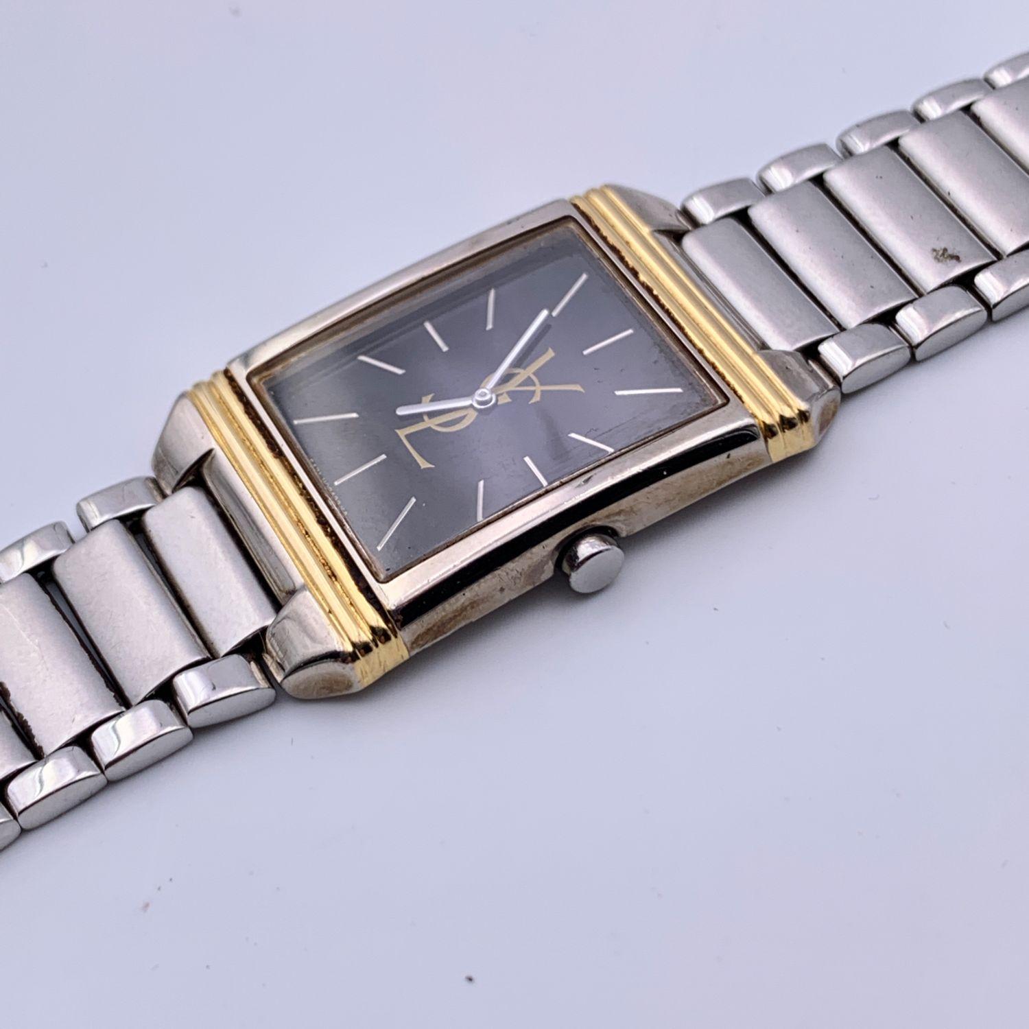Vintage Yves Saint Laurent wrist watch. 5421 HO4724 Y. Gold-tone and silver-tone metal and stainless steel rectangle case (23 mm). Black dial with YSL logo. Stainless steel strap. Circumference at wrist: 6.5 inches - 16.5 cm

Condition

A -