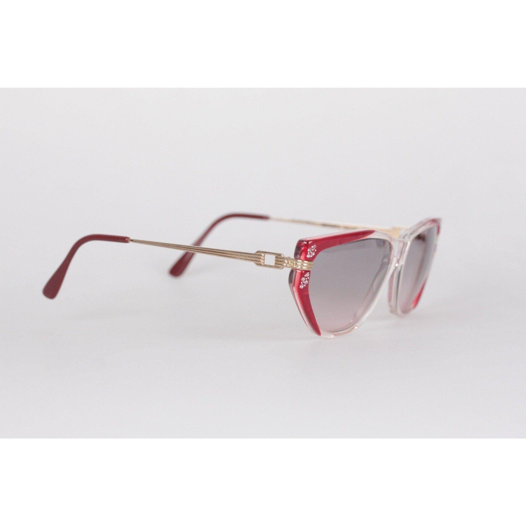 MATERIAL: Acetate, Metal COLOR: Red LENS COLOR: Blue MODEL: Euterpe GENDER: Women SIZE: Medium CONDITION DETAILS: NEW OLD STOCK - Never Worn or Used - They will come with a GENERIC Case MEASUREMENTS: TEMPLE MAX. LENGTH: 140 mm TEMPLE TO TEMPLE - MAX