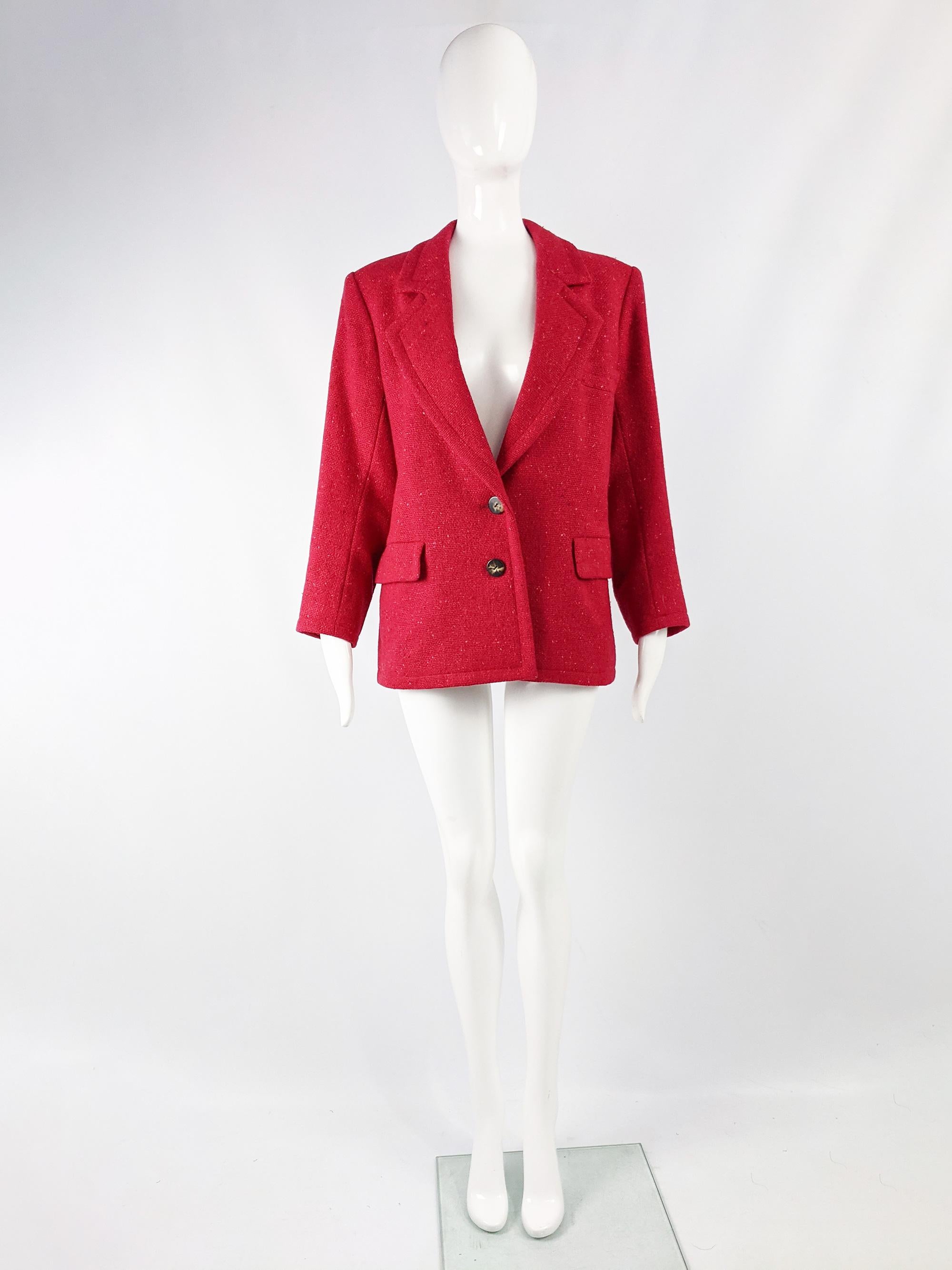 An incredibly chic vintage womens Yves Saint Laurent Rive Gauche blazer from the 80s in a pinkish red raspberry bouclé wool tweed with shoulder pads that extend the shoulder line without adding bulk on top for an edgy, high fashion shape. 

Size: