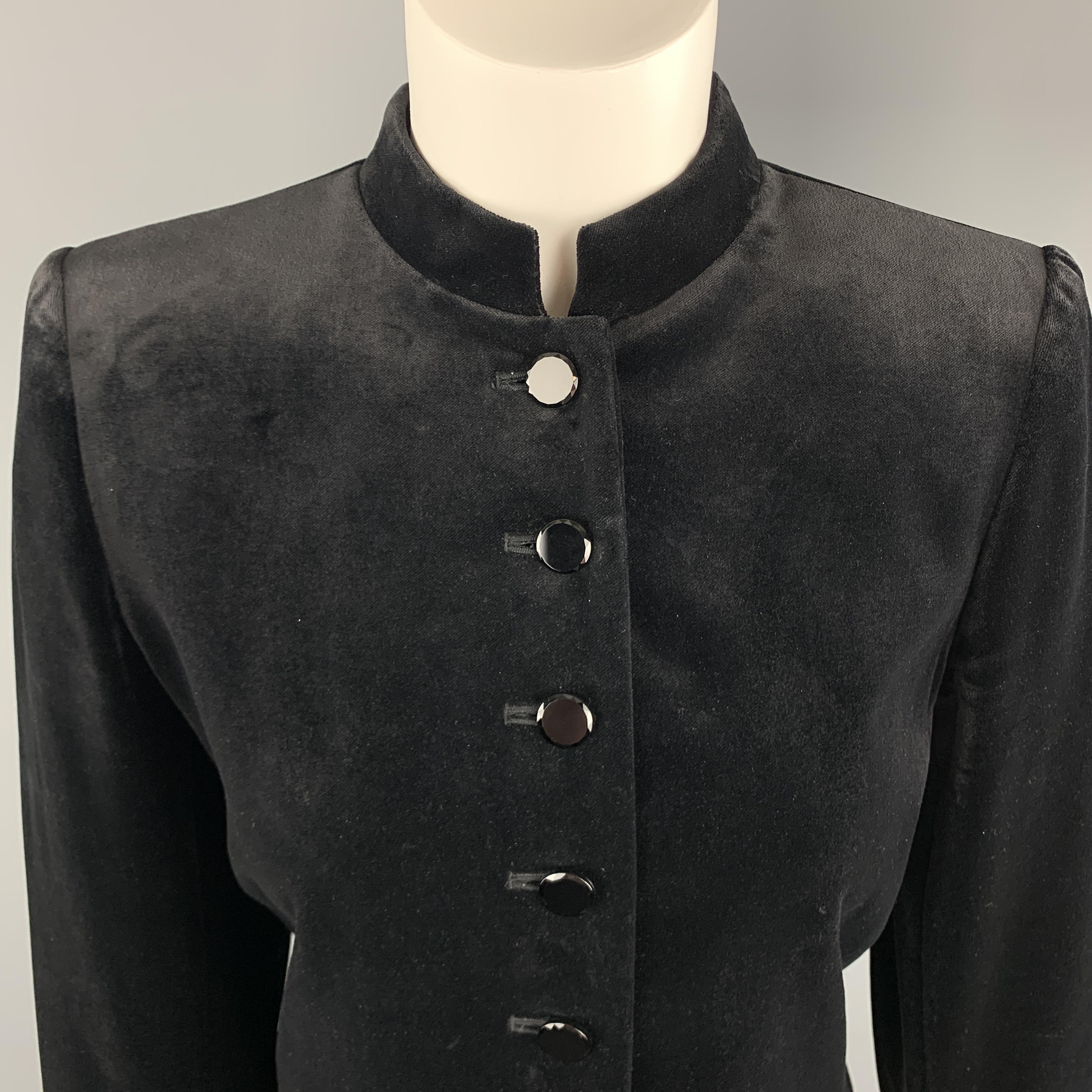 Vintage YVES SAINT LAURENT VARIATIONS jacket comes in black velvet with a band collar, crystal buttons and cropped hem. Made in France.

Excellent Pre-Owned Condition.
Marked: 6

Measurements:

Shoulder: 15 in.
Bust:  38 in.
Sleeve: 22 in.
Length: