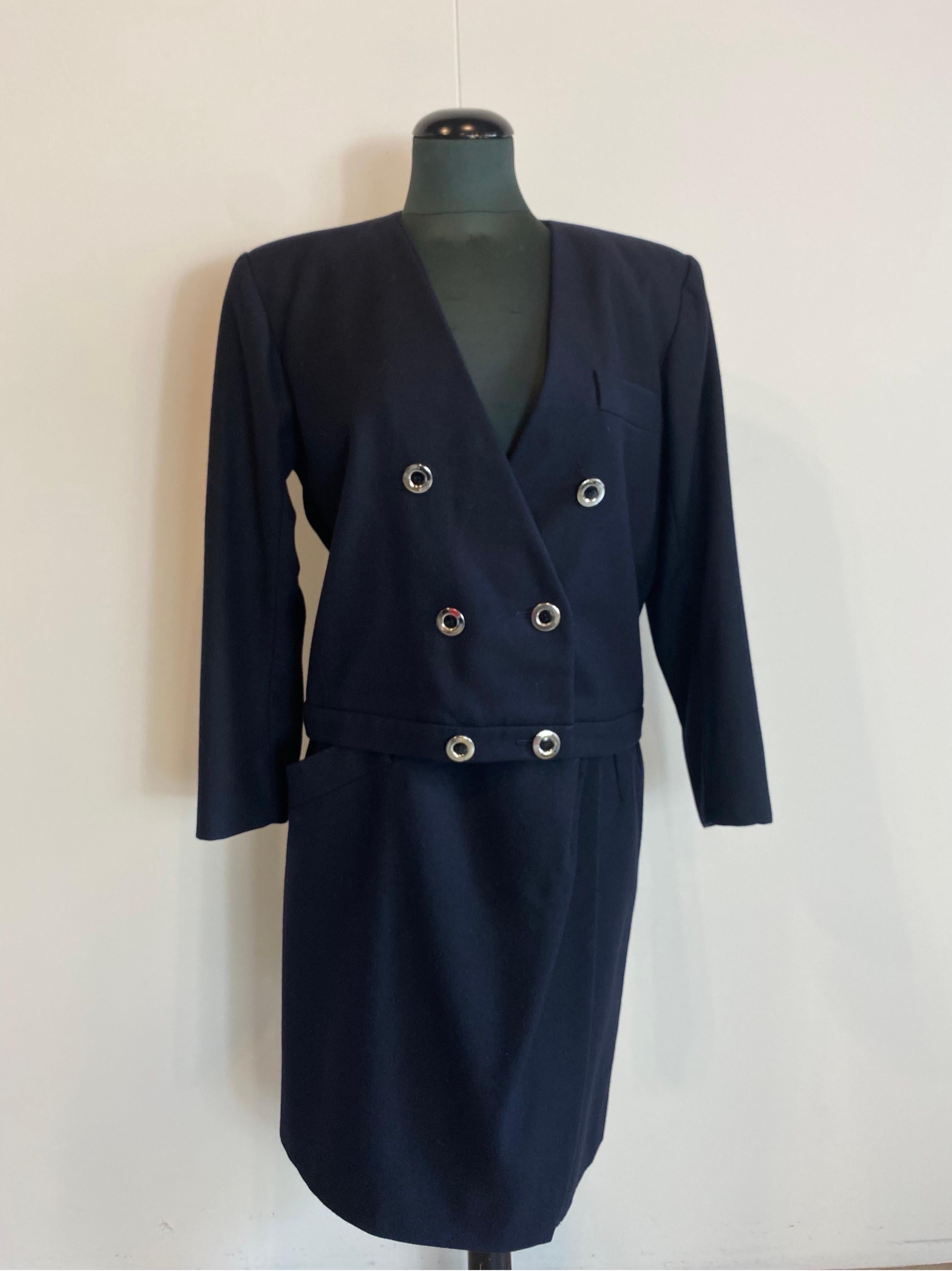 Vintage Yves Saint Laurent blue skirt suit set 
Made of wool. With internal lining. 
Midnight blue color. with silver buttons. One slightly peeled off the lacquer
Wrap skirt with button closure and one side pocket.
Size 40 French, 
Blazer:
Shoulders