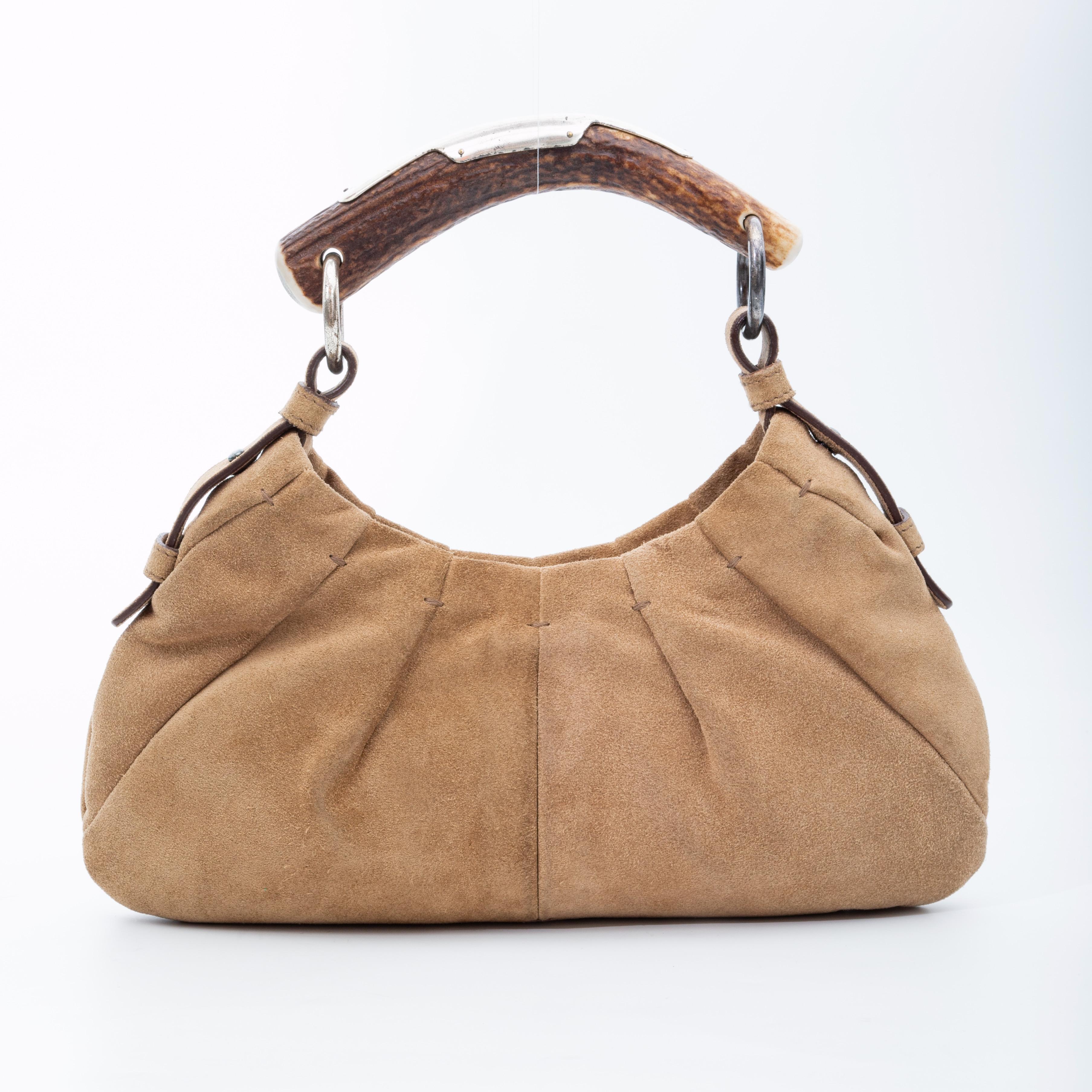 COLOR: Beige
MATERIAL: Suede and deer antler
ITEM CODE: 111719 001998
MEASURES: H 5” x L 12” x D 2”
DROP: 5”
EST. RETAIL: $1900
CONDITION: Good - light discolouration, marks and signs of use.

Made in Italy