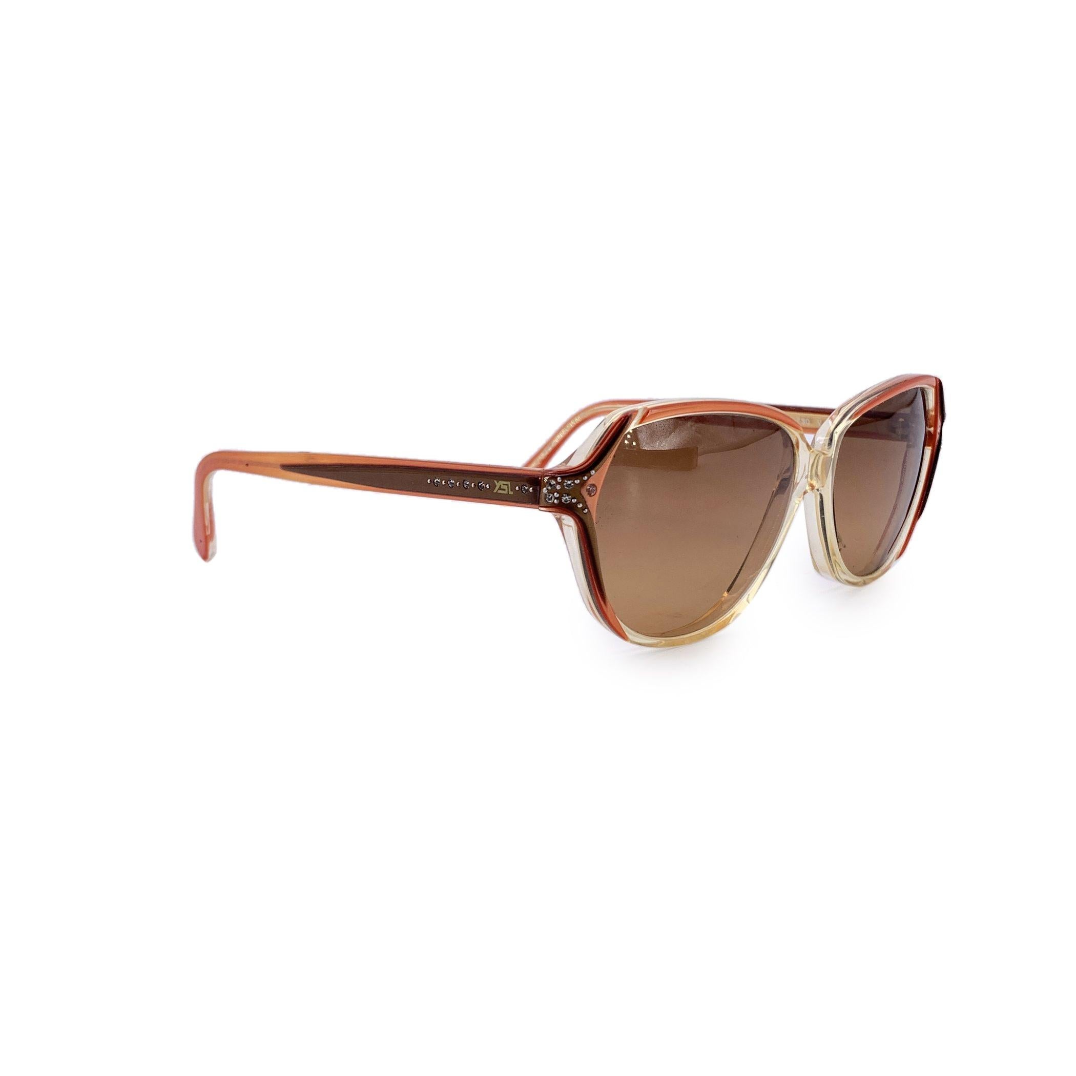 A bold expression of 1980s flair, the Yves Saint Laurent Vintage Yellow Menelas Sunglasses are a rare fusion of geometric precision and sunlit charm. Made in France and crafted from durable plastic, this standout model embodies the fearless design