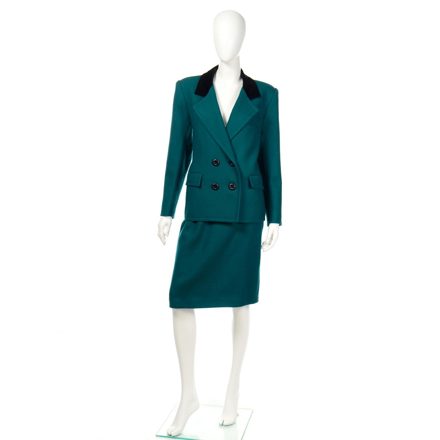 This is a beautiful vintage Yves Saint Laurent teal green wool suit with black velvet lapels. The double breasted jacket has shoulder pads for added structure and a nice, longer silhouette. There is a single breast pocket with flap pockets and the