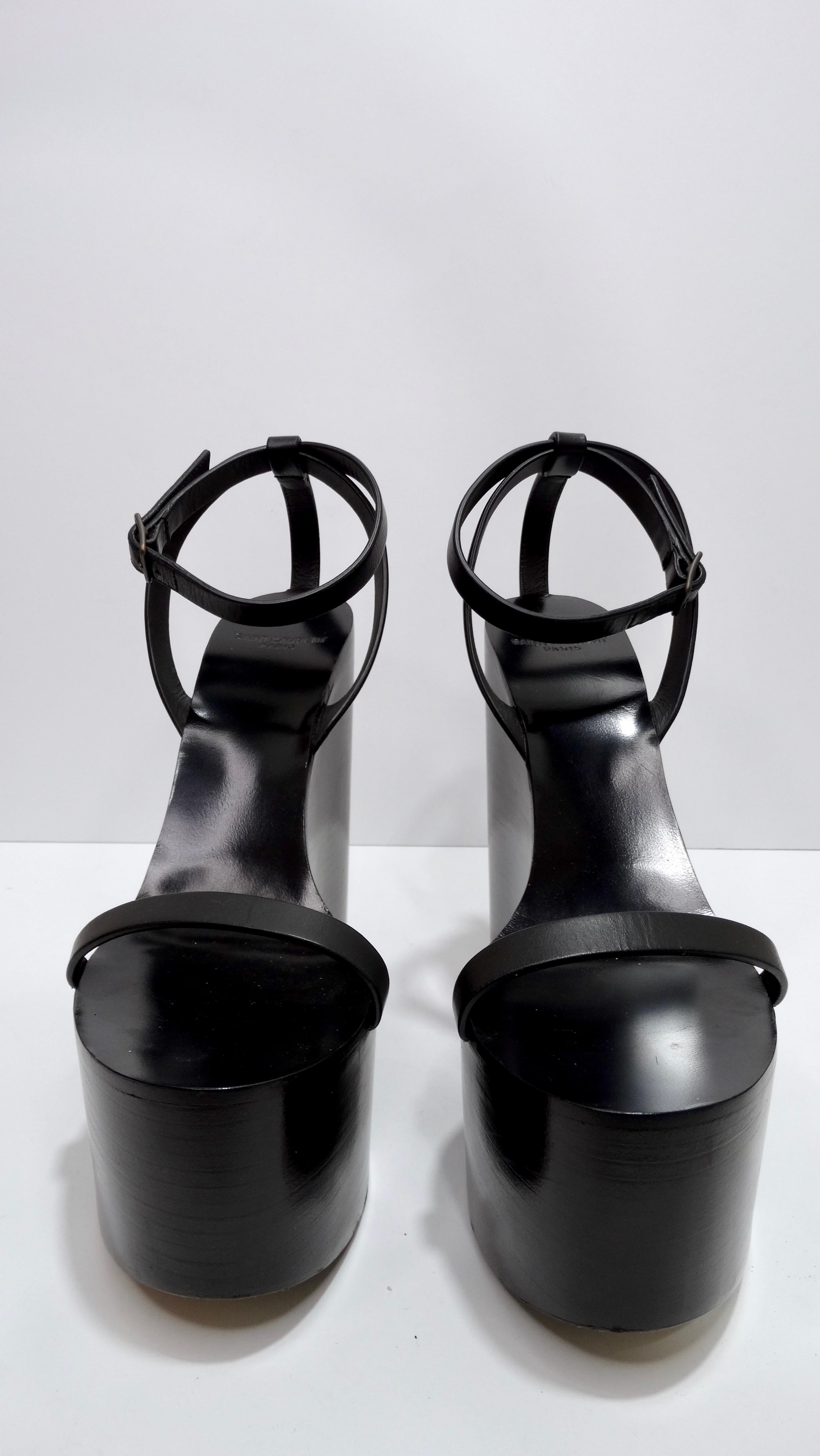 These are the most stunning Saint Laurent heels! The simple design is complete elegance. These heels are featured in a beautiful black wood that is in great condition with no notable flaws. This is a sandal silhouette with one toe strap and a