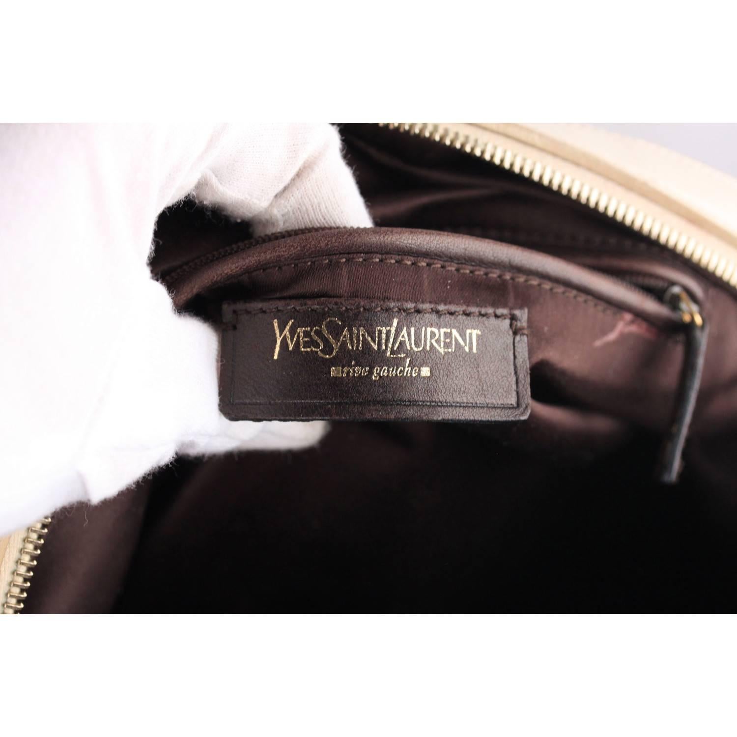 This bag will come with a CERTIFICATE of AUTHENTICITY provided by Entrupy, leading International Fashion Authenticators.

- YVES SAINT LAURENT iconic 'Muse bag' in white leather 
- Woven detailing
- Roomy interior 
- Whip stitching
- Gold-tone