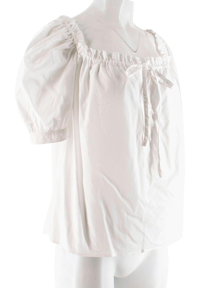 Yves Saint Laurent white off the shoulder front tie detail blouse. Featuring a short puff sleeves and a slightly cropped and relaxed fit. A perfect staple for any summer wardrobe. Made in Italy. Dry clean only.

Please note, these items are