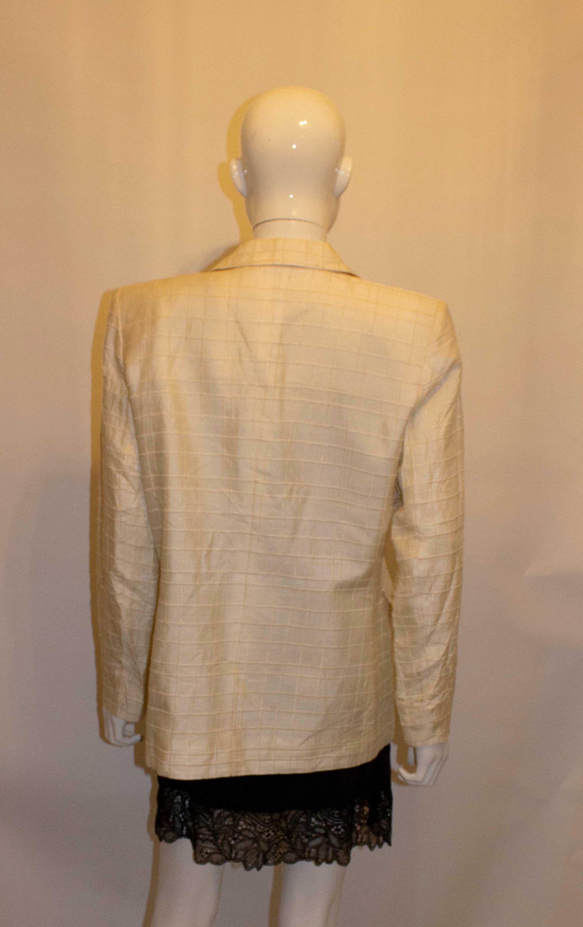 A great jacket for Fall. A wonderful , heavy white silk jacket with stitch panel detail from Yves Saint Laurent , Variation line. 
The jacket is a size 42 m, with 4 buttons on the front and two flap pockets. It is fully lined. 
Measurements: Bust up