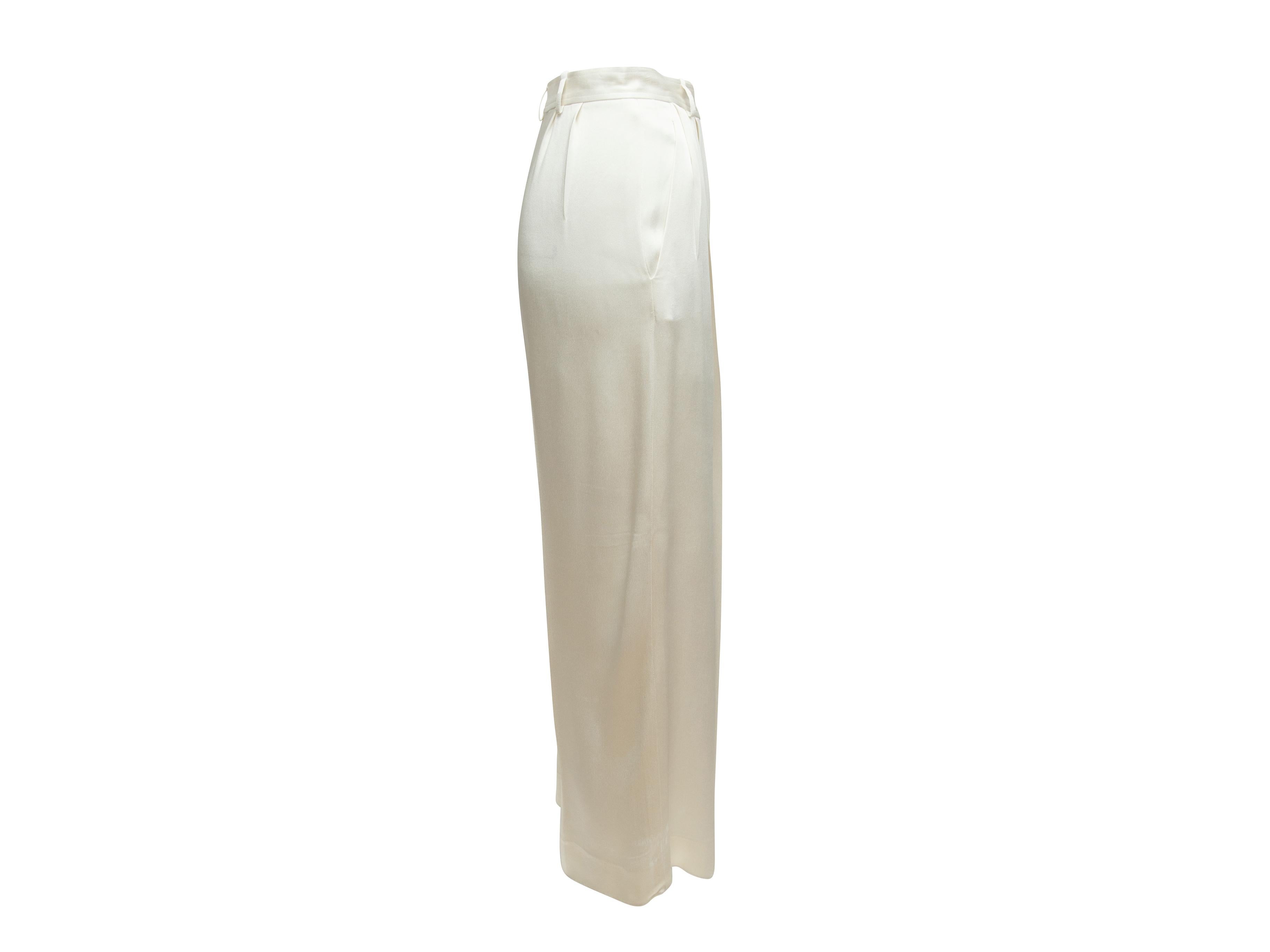 Product details: Vintage white silk wide-leg trousers by Yves Saint Laurent. Designer size 40. Dual hip pockets. Zip closure at front. 26