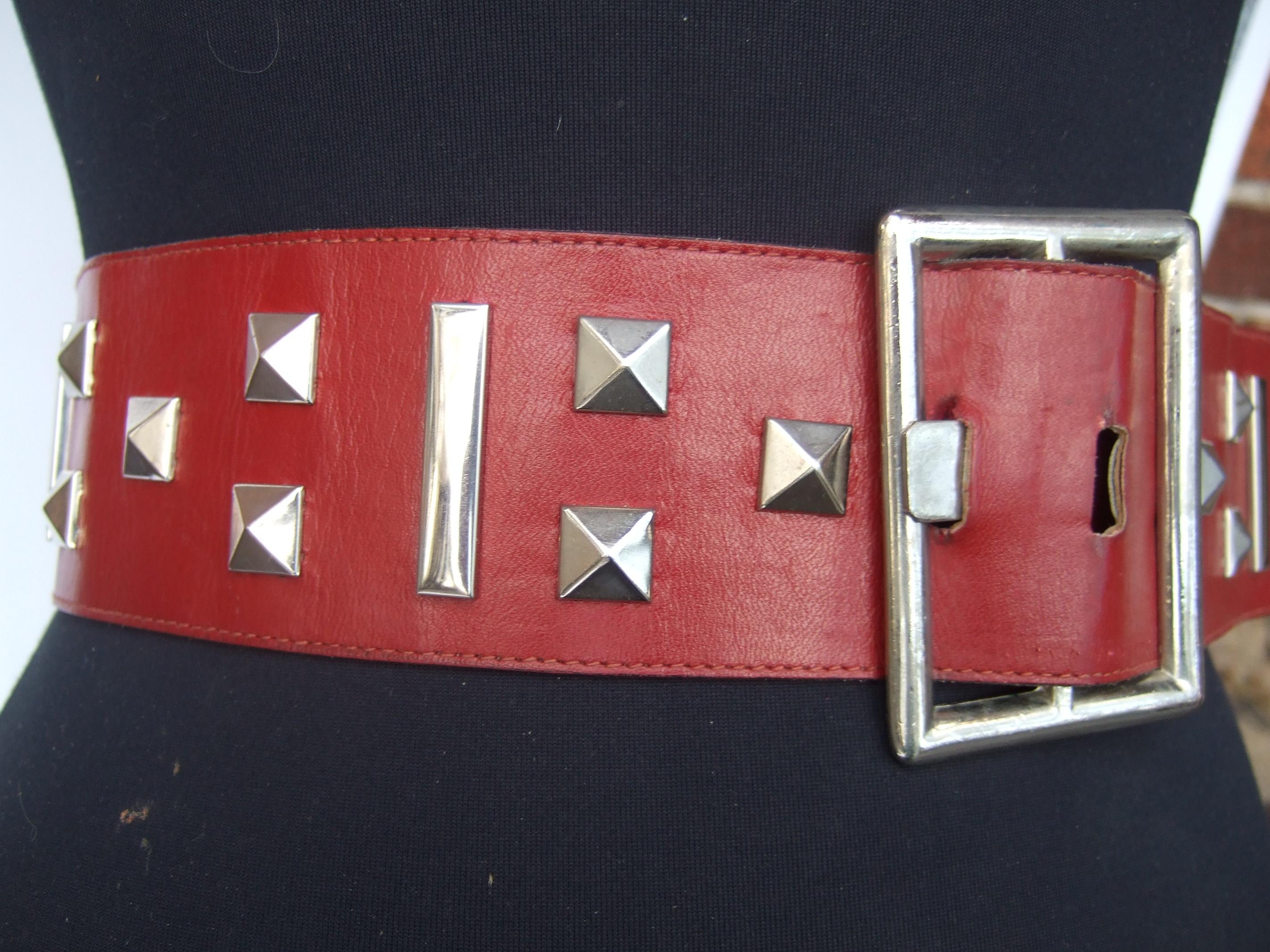 Yves Saint Laurent Wide Red Leather Chrome Grommet Studded Belt c 1970s In Good Condition For Sale In University City, MO