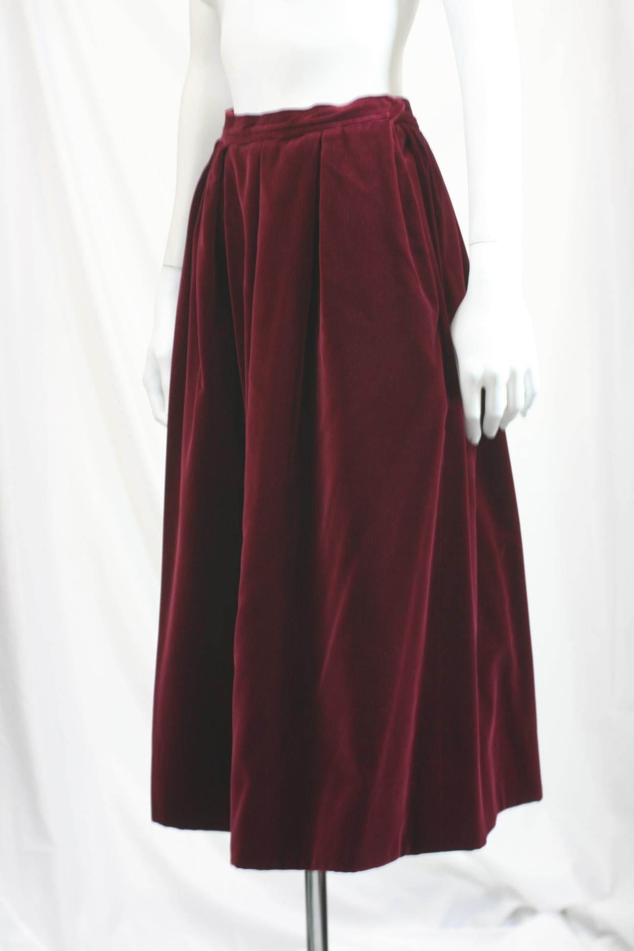 Yves Saint Laurent Claret Wine Cotton-rayon Velvet Skirt, easy construction with a series of inverted pleats which release from waist  to fullness at hem. Side zip closure and practical YSL side pockets as well. A timeless classic, likely from the
