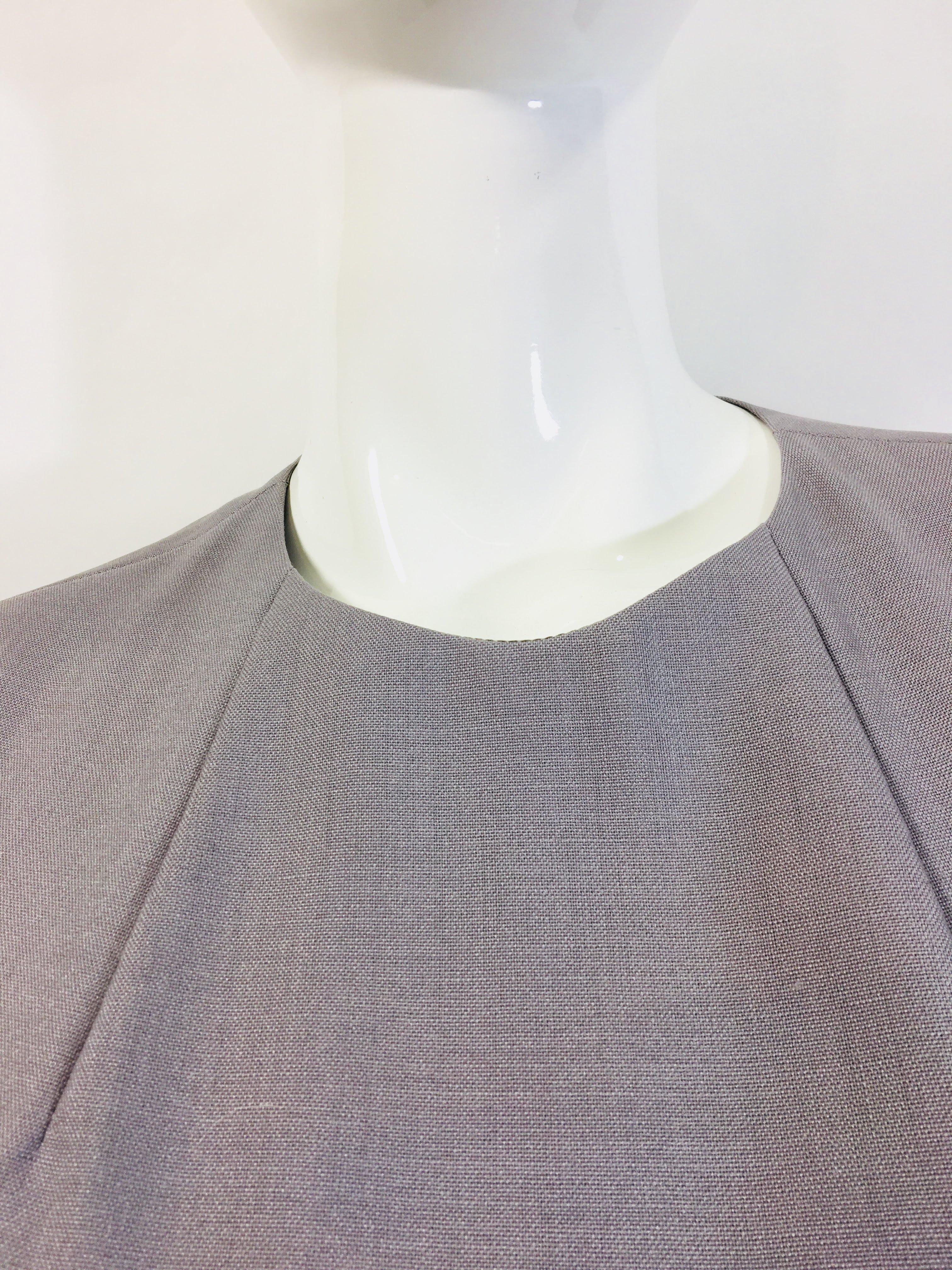 Yves Saint Laurent Gray Long Sleeve Wool Jumpsuit with Zipper Closure
Size 34