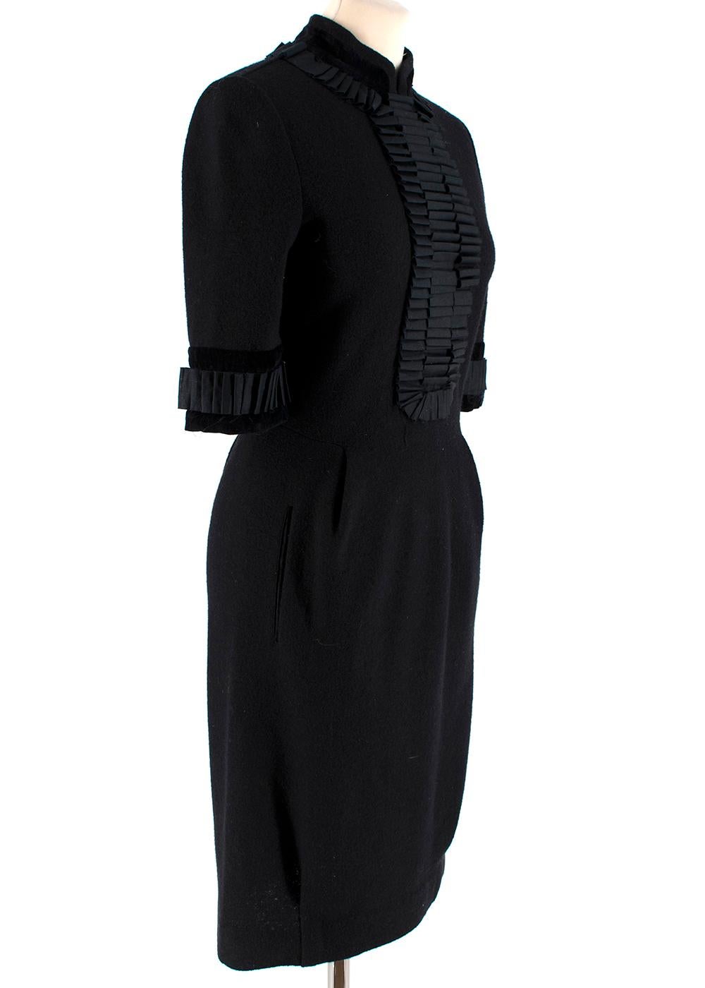 Yves Saint Laurent Wool Ruffle Trim High Neck Dress

- High neck ruffle trim design 
- Silk ruffle detailing 
- Velvet effect cuff and neck trims
- Midi length sleeves and hem 
- Front darts
- Front welt pockets 
- Concealed back zip and eyelet