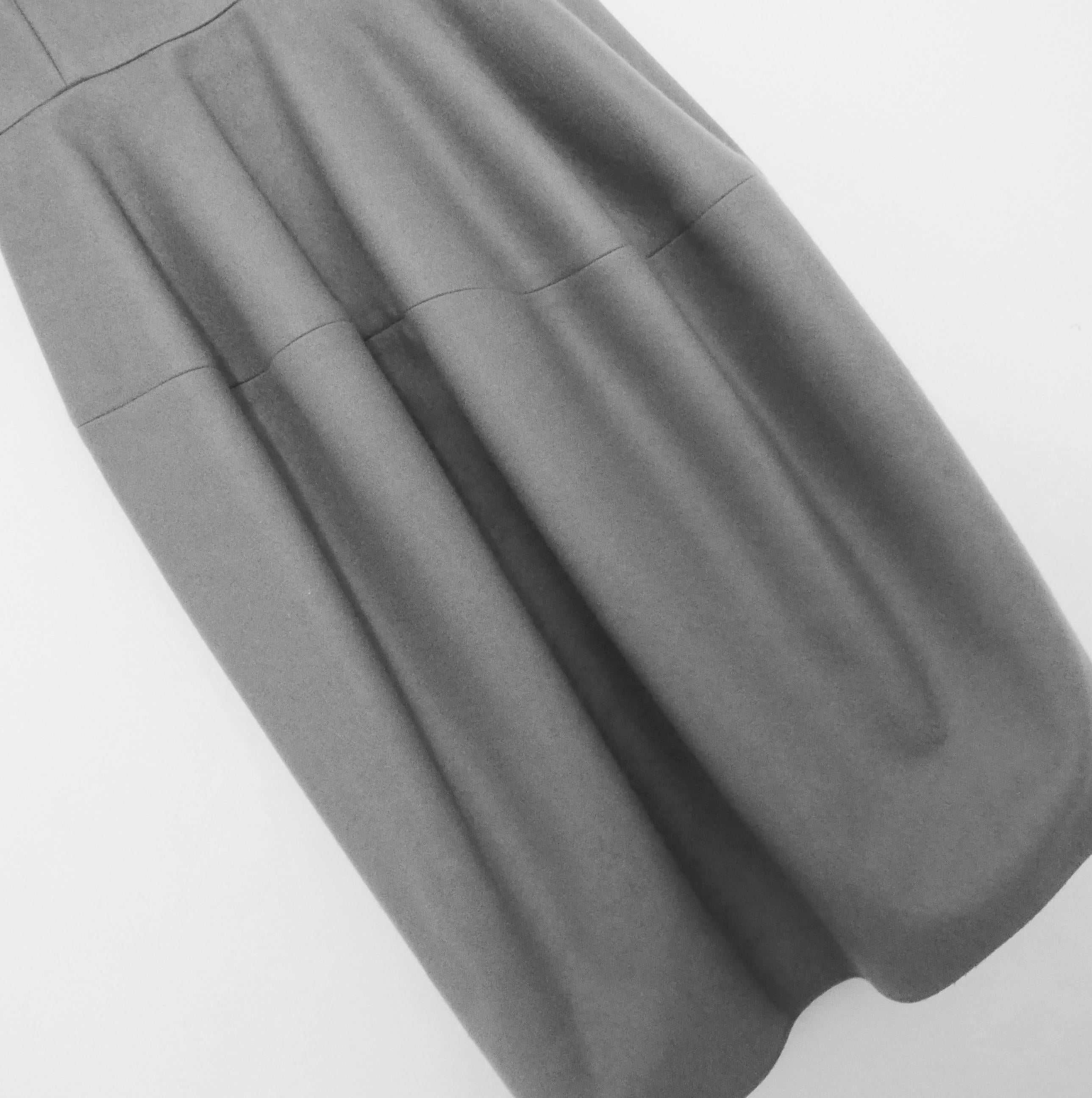 Iconic unworn archival dress from Stefano Pilati's Fall 2008 Yves Saint Laurent collection - one of Pilati's most important collections for the label. 

Gorgeously crafted from super smooth and soft dove grey cashmere, it has one of Pilati's most