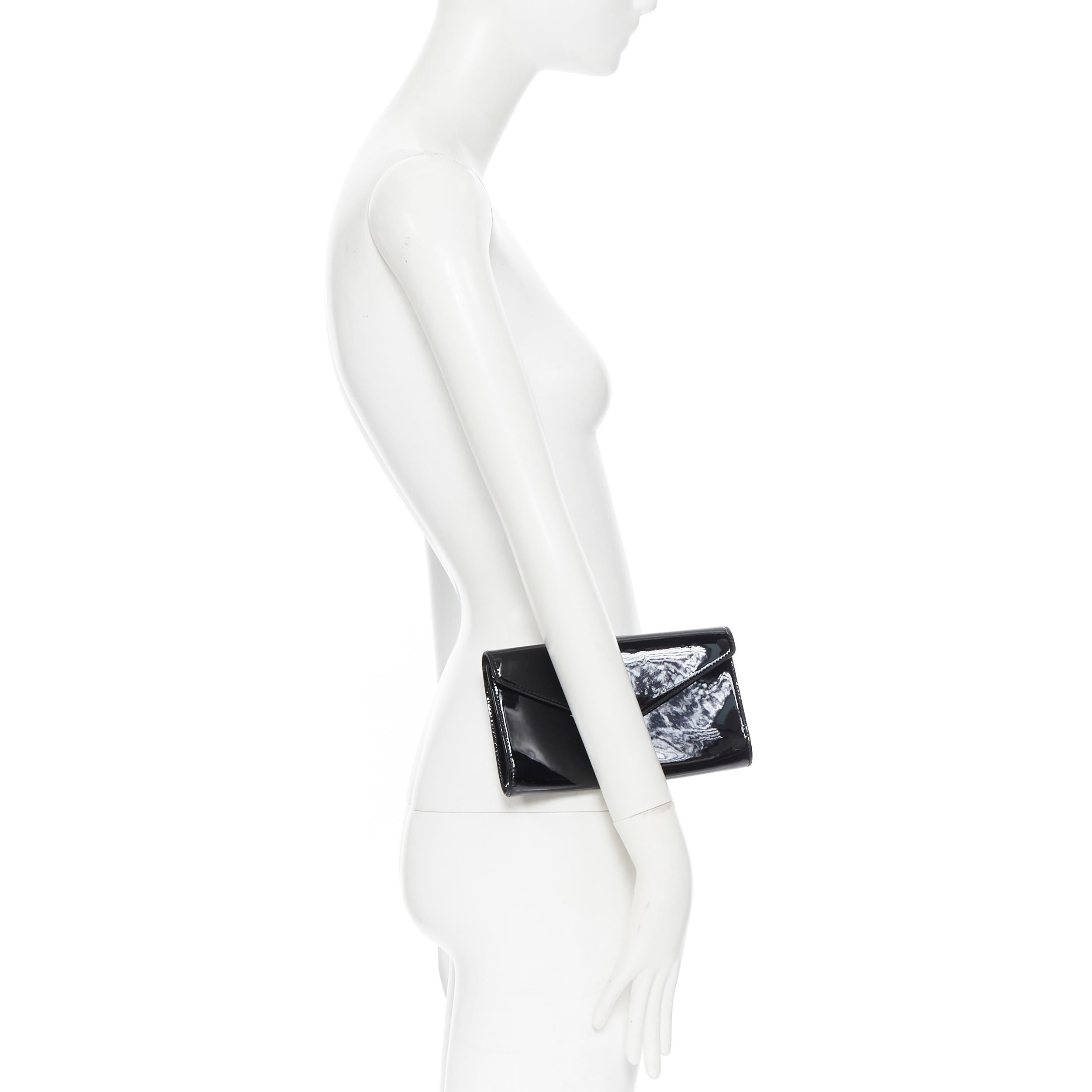 YVES SAINT LAURENT Y Mail Envelope black patent gold lettering flap clutch bag
Brand: Yves Saint Laurent
Designer: Yves Saint Laurent
Model Name / Style: Y Mail
Material: Patent leather
Color: Black
Pattern: Solid
Closure: Button
Extra Detail:
