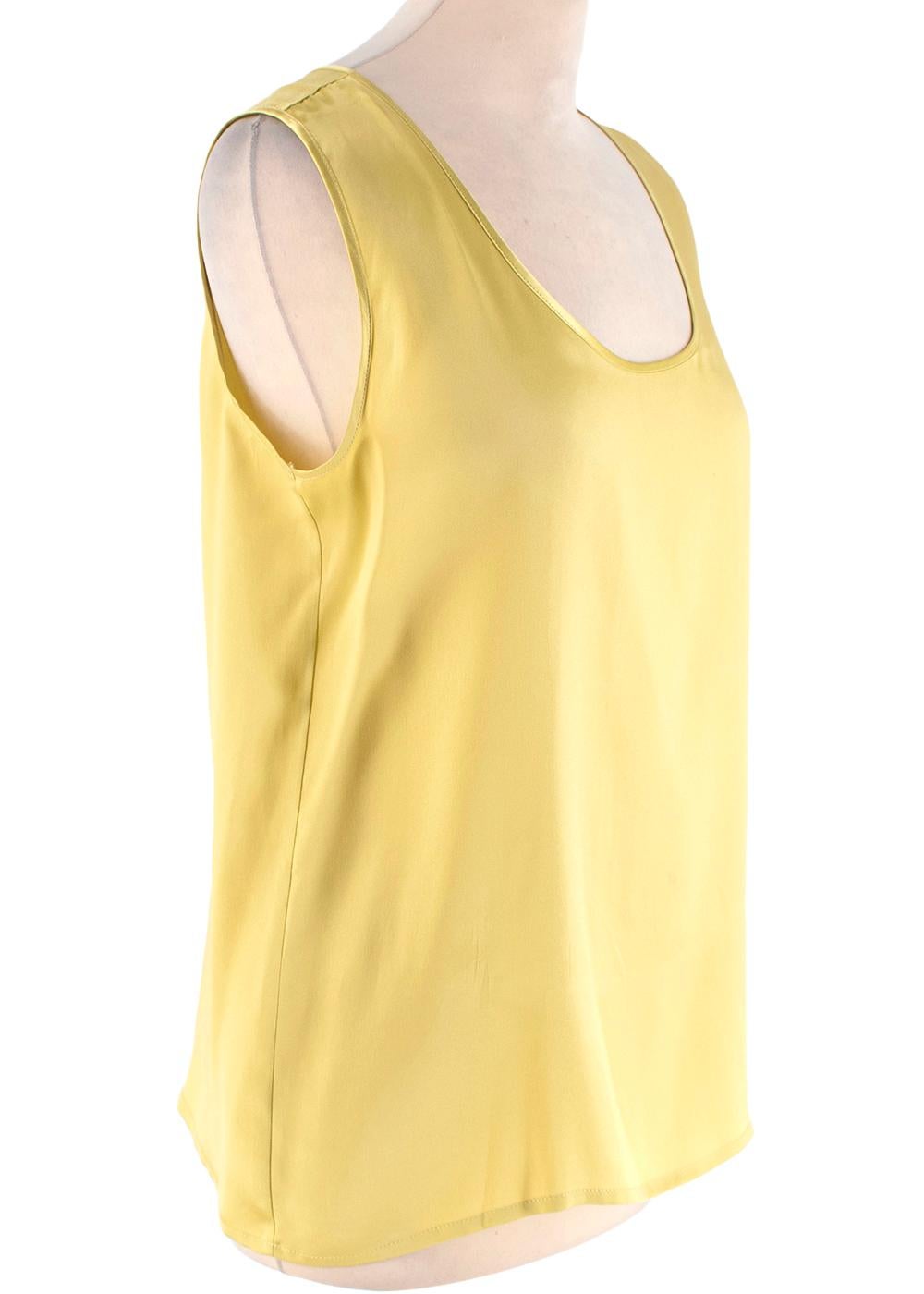 Yves Saint Laurent Yellow Silk Satin Tank Top

-Luxurious extra soft silk texture 
-Classic cut 
-Beautiful lime green hue 
-Gorgeous and bright lime green hue 
-Timeless elegant design 

Materials:
100% silk 

Dry clean only 

Made in France