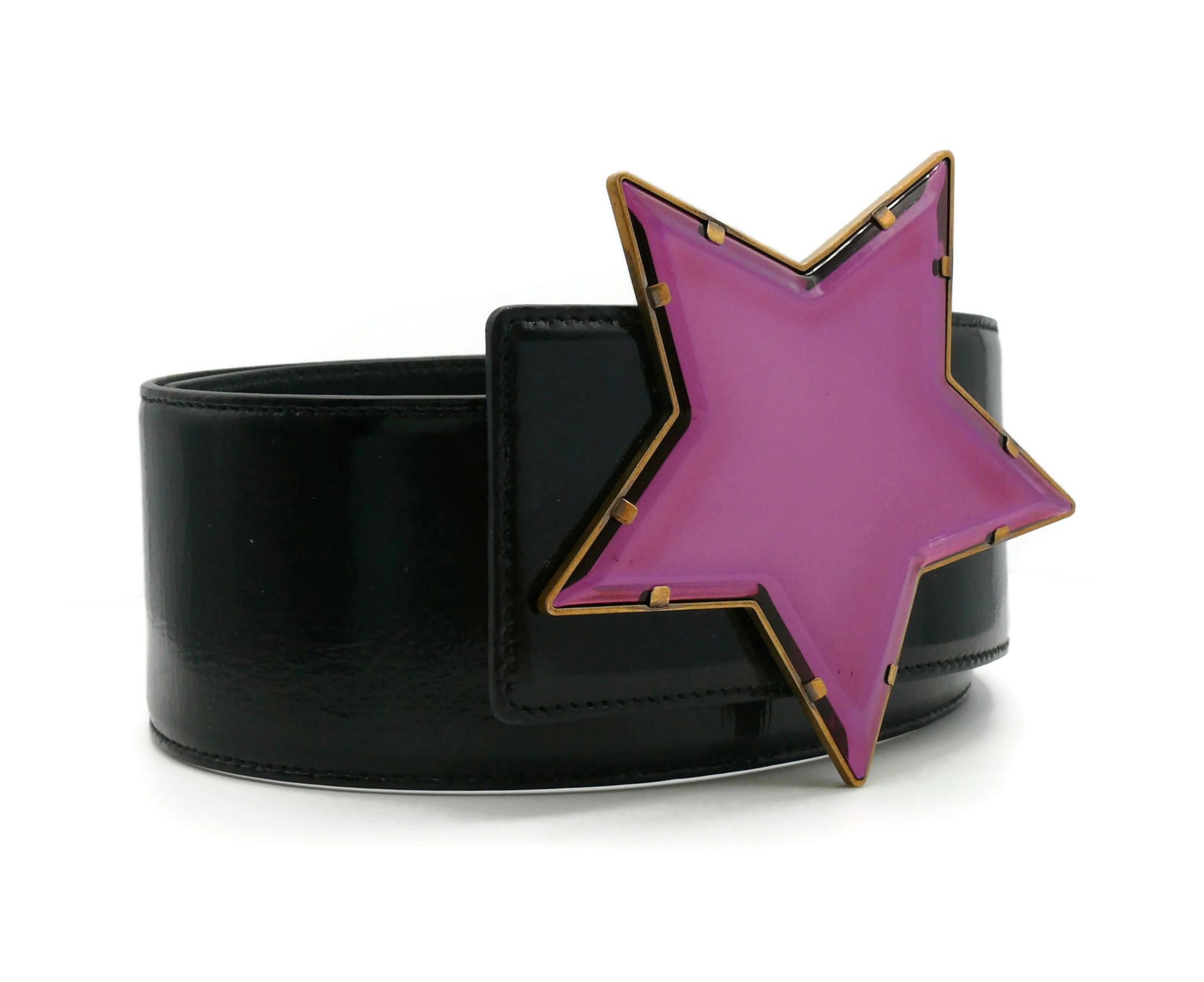 YVES SAINT LAURENT wide black patent leather belt featuring a massive bronze tone star buckle embellished with a mirror plexiglass in pink/mauve color.

Snap button closure (3 lengths).

Embossed YVES SAINT LAURENT Rive Gauche Made in