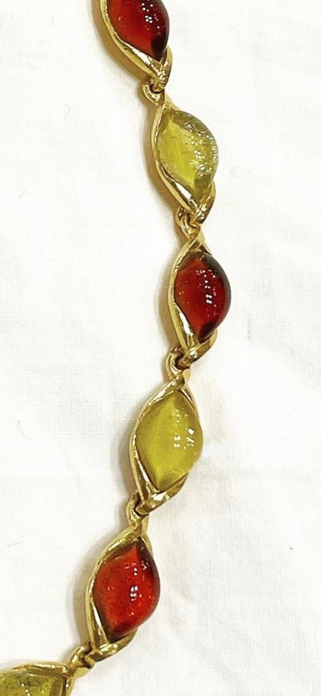 1980s gorgeous vintage YVES SAINT LAURENT oval shape amber and honey coloured glass choker necklace! 
Gilt chain with the YSL logo. 
Can really add just that little extra elegance to any outfit! 
Great with jeans, and perfect with a dress.
You can