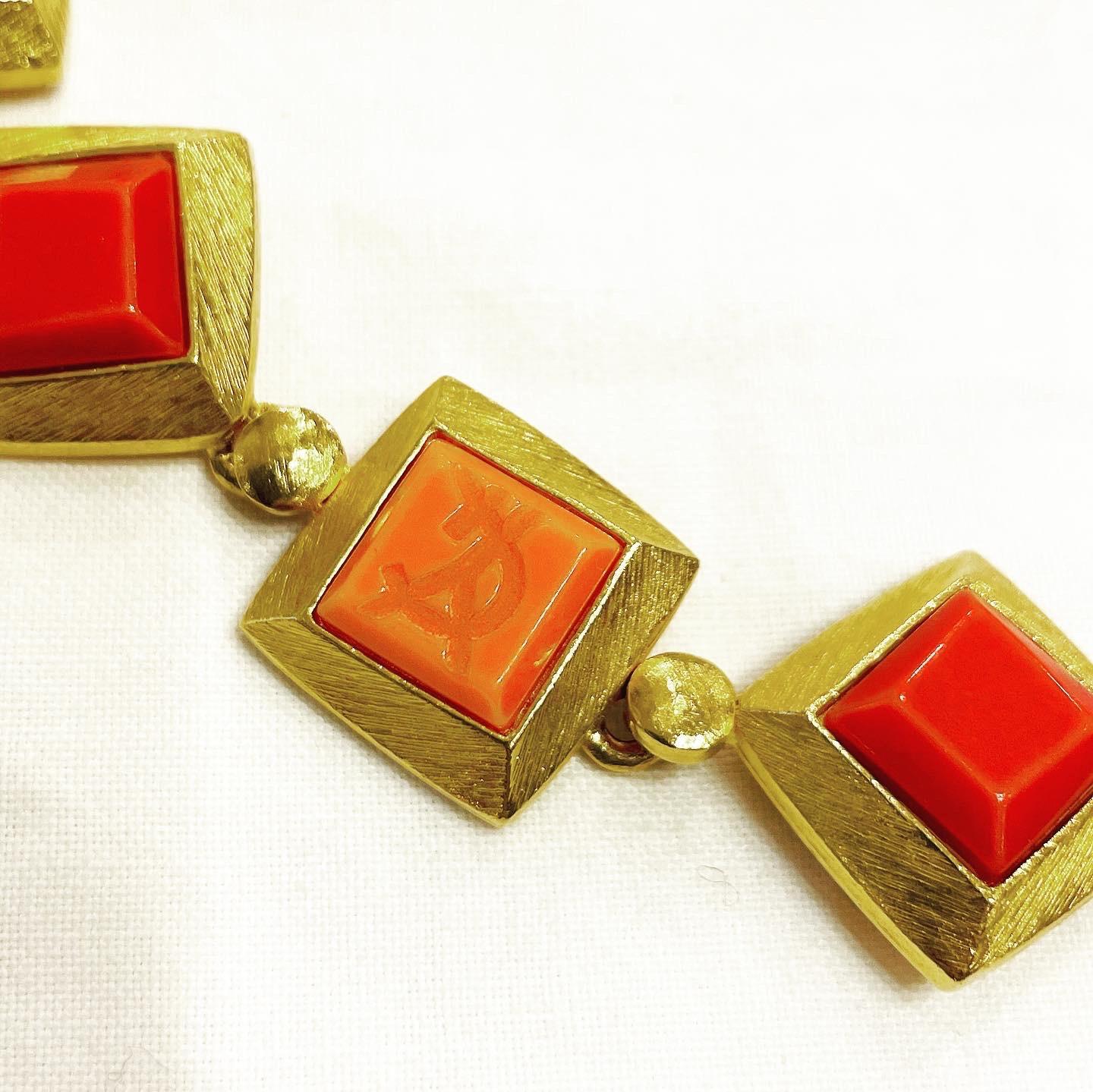 1980s gorgeous vintage YVES SAINT LAURENT square shape orange and red resin choker necklace! 
Gilt chain with the YSL logo. 
Can really add just that little extra elegance to any outfit! 
Great with jeans, and perfect with a dress.
You can wear it
