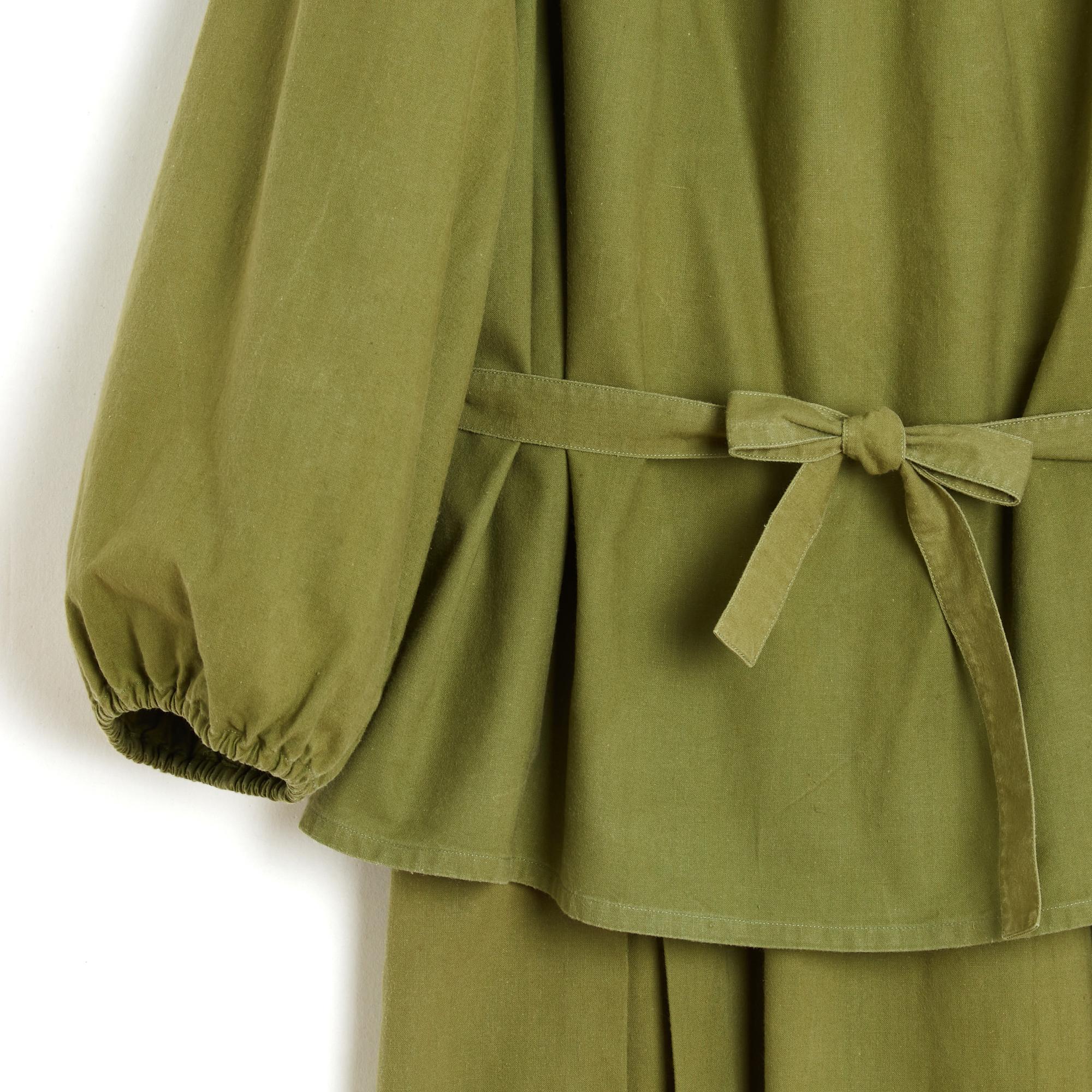Yves Saint Laurent Rive Gauche YSL set circa 1985 in olive green cotton cloth composed of a blouse, gathered dancer collar, straight cut, long sleeves tightened by an elastic with its matching belt, and a skirt, high and wide stitched waist