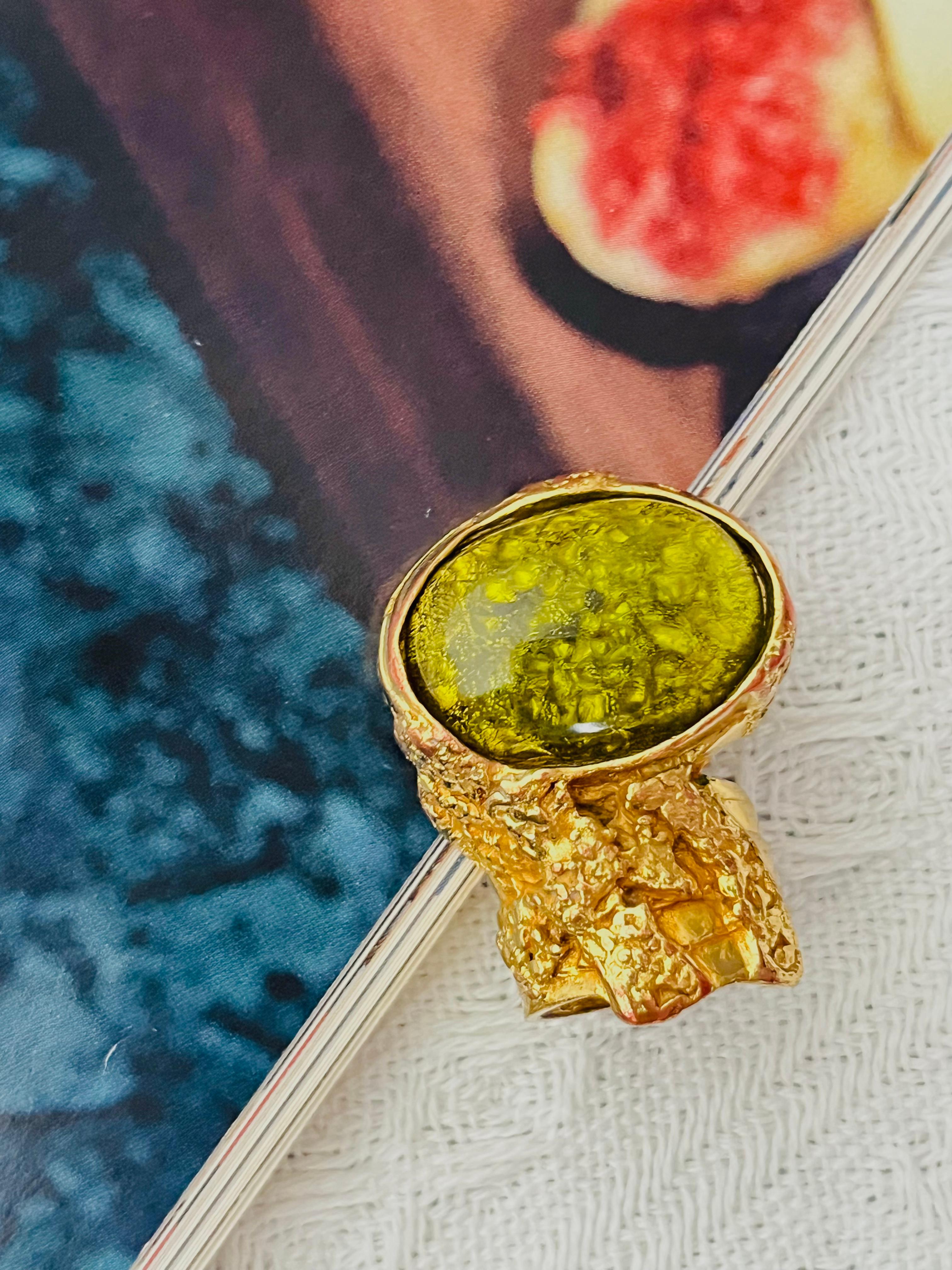 Yves Saint Laurent YSL Arty Vintage Grass Green Cabochon Stone Statement Chunky Cocktail Monderist Elegant Ring, Size 6, Gold Plated

Very rare to find this colour. Good condition. Stone is good, but colour loss at band and back. Still very good to