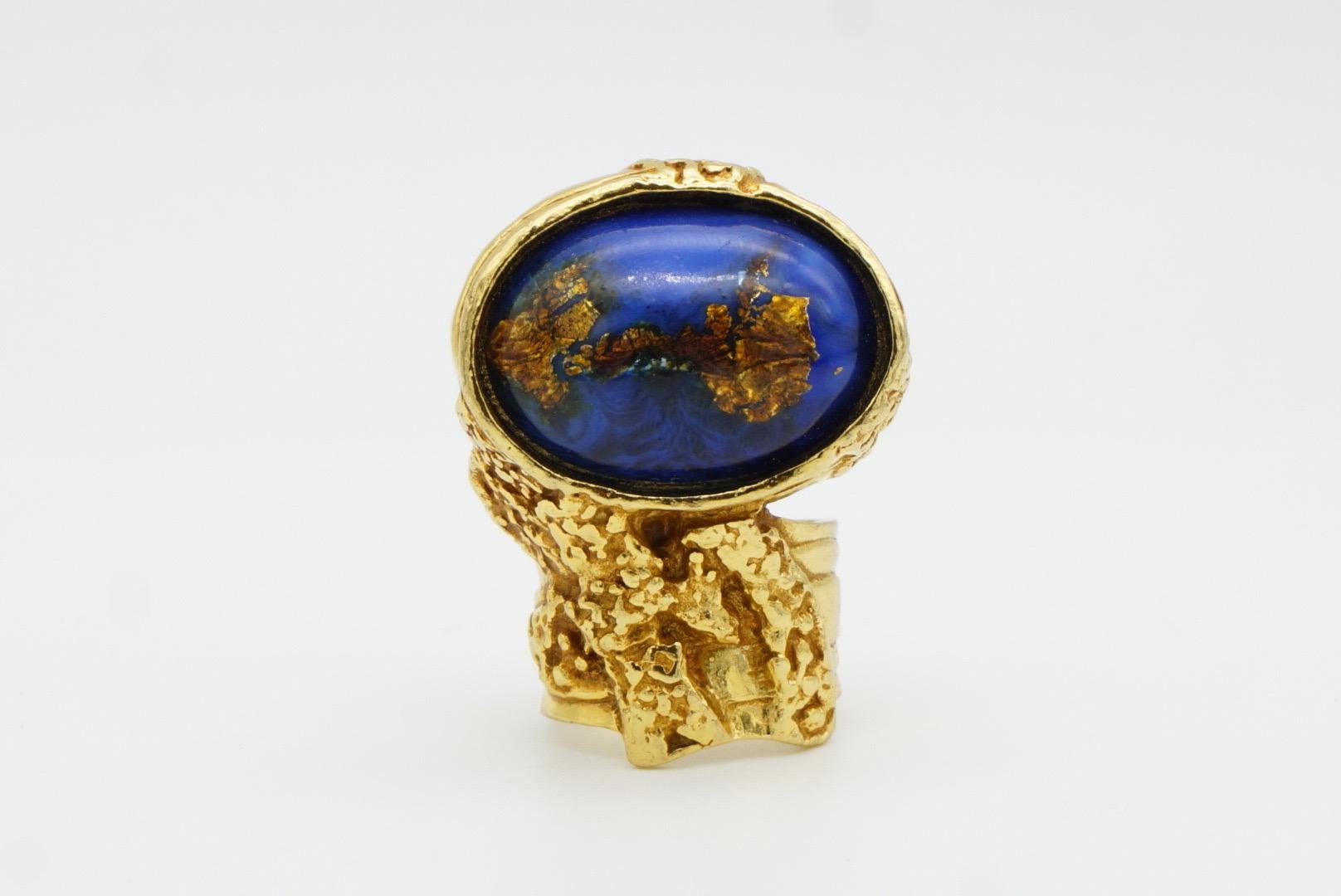Yves Saint Laurent YSL Arty Vintage Unisex Large Lapis Navy Blue Cabochon Foil Cocktail Chunky Statement Ring, US 5, Gold Tone

Very excellent condition. Vintage. Very rare to find this colour. 100% genuine. 

Signed on the back YSL, Made in