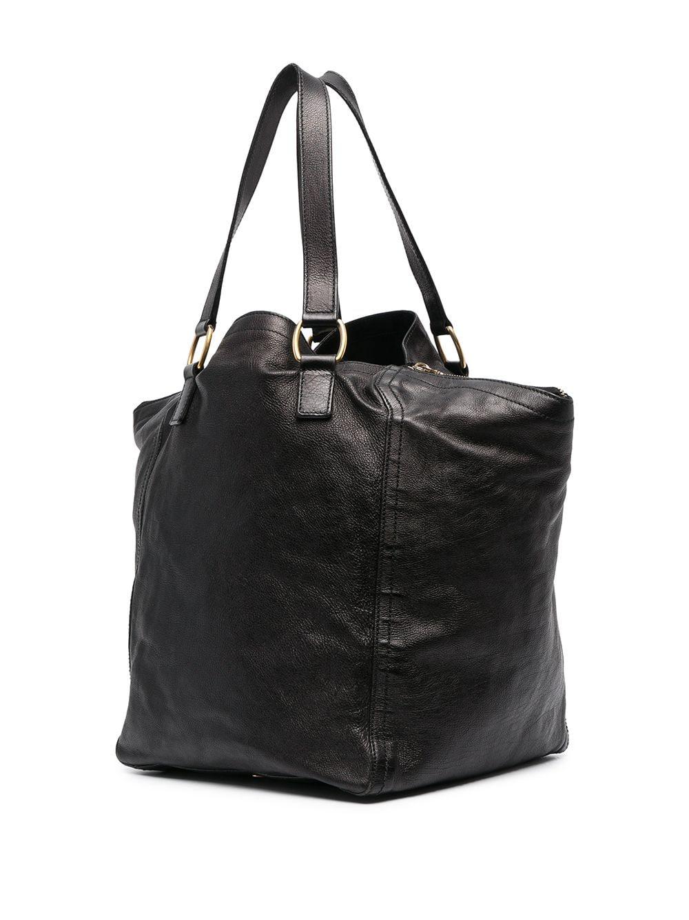 Yves Saint Laurent YSL black leather Downtown tote bag featuring side zip fastening, gold-tone hardware, decorative buckle detailing, flat top handles, full lining, bottom large YSL pitted. 
Length 13.7in. (35cm)
Height  18.5 in (47cm)
Depth 9.8in.