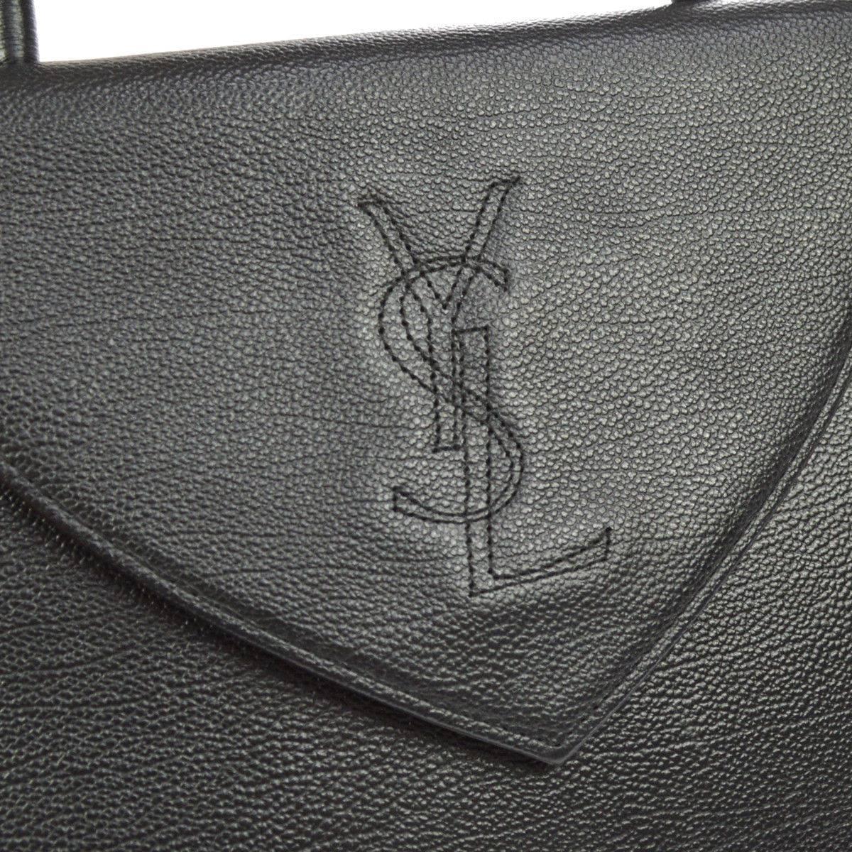 

Yves Saint Laurent YSL Black Leather Top Handle Kelly Style Shoulder Satchel Flap 
Bag in Box

Leather
Woven lining
Magnetic closure
Handle drop 4.25