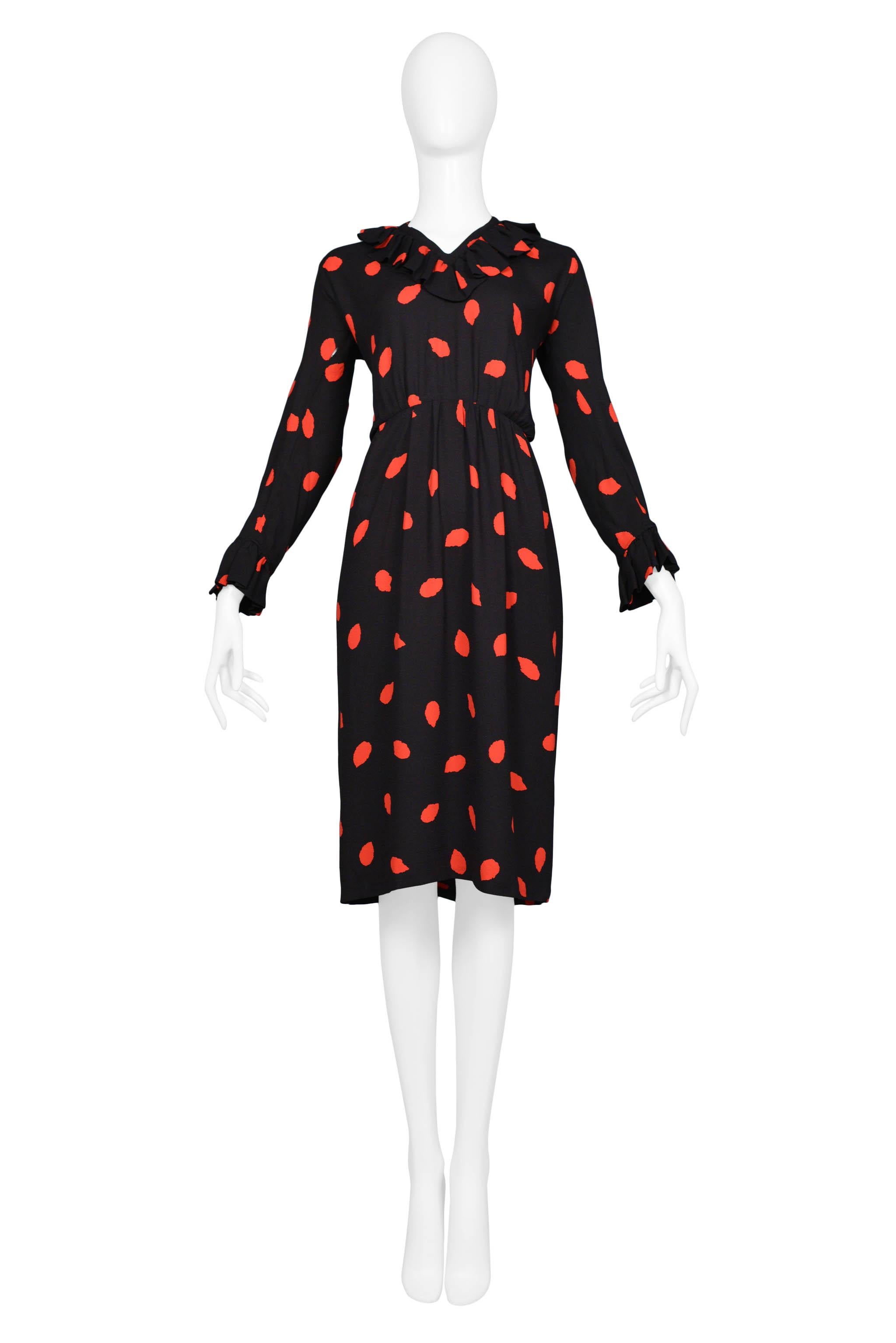 Resurrection Vintage is excited to offer a vintage Yves Saint Laurent black silk day dress with red print. Ruffles at collar and cuffs. High-waisted style with slight gathers. Circa 1970's.

Yves Saint Laurent
Size 42
Silk
Excellent Vintage