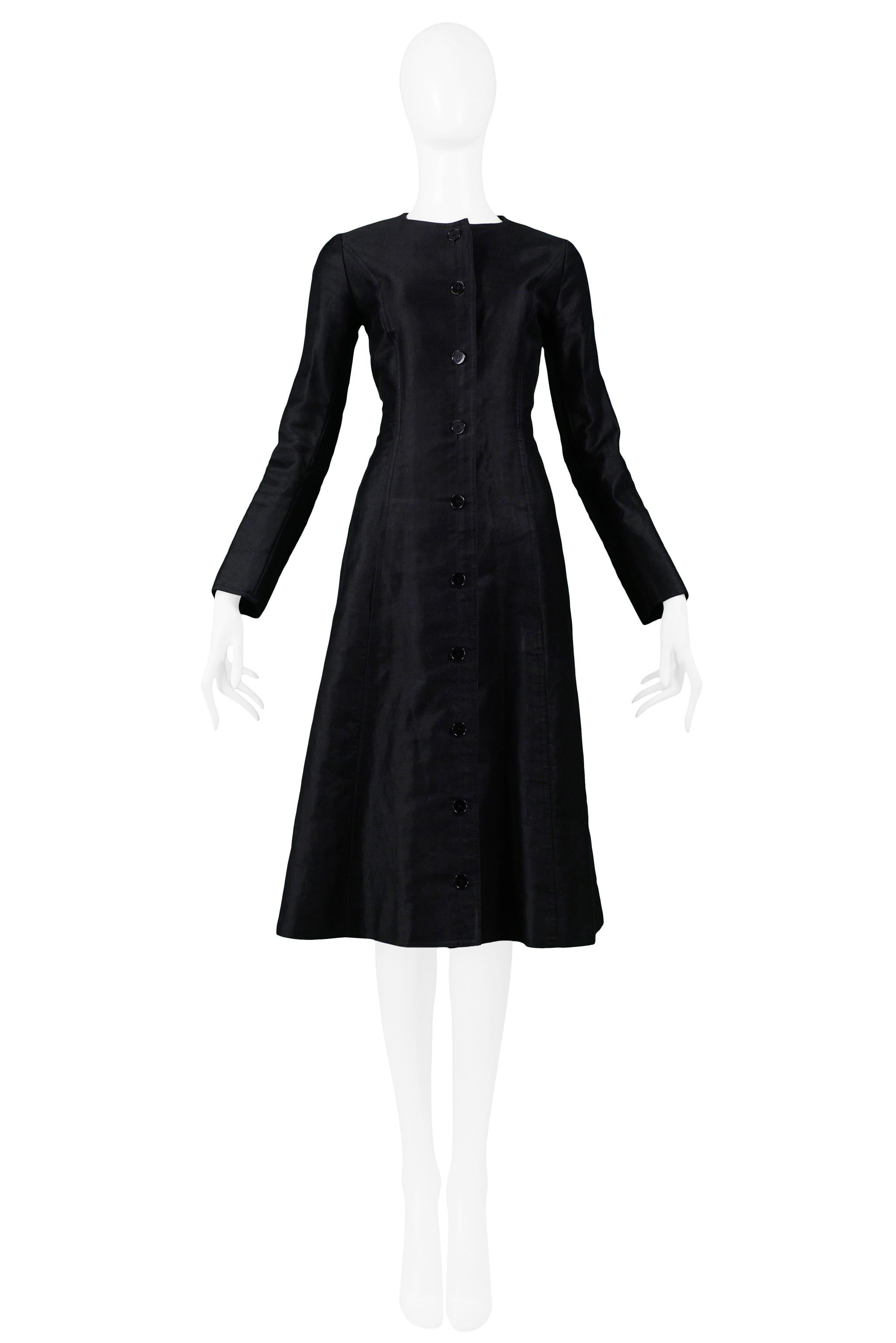Resurrection Vintage is excited to offer a classic vintage Yves Saint Laurent black cotton sateen coat featuring a fitted body with a slightly a-line skirt, long sleeves, and black buttons.

Yves Saint Laurent
Size 36
Cotton Sateen 
Excellent