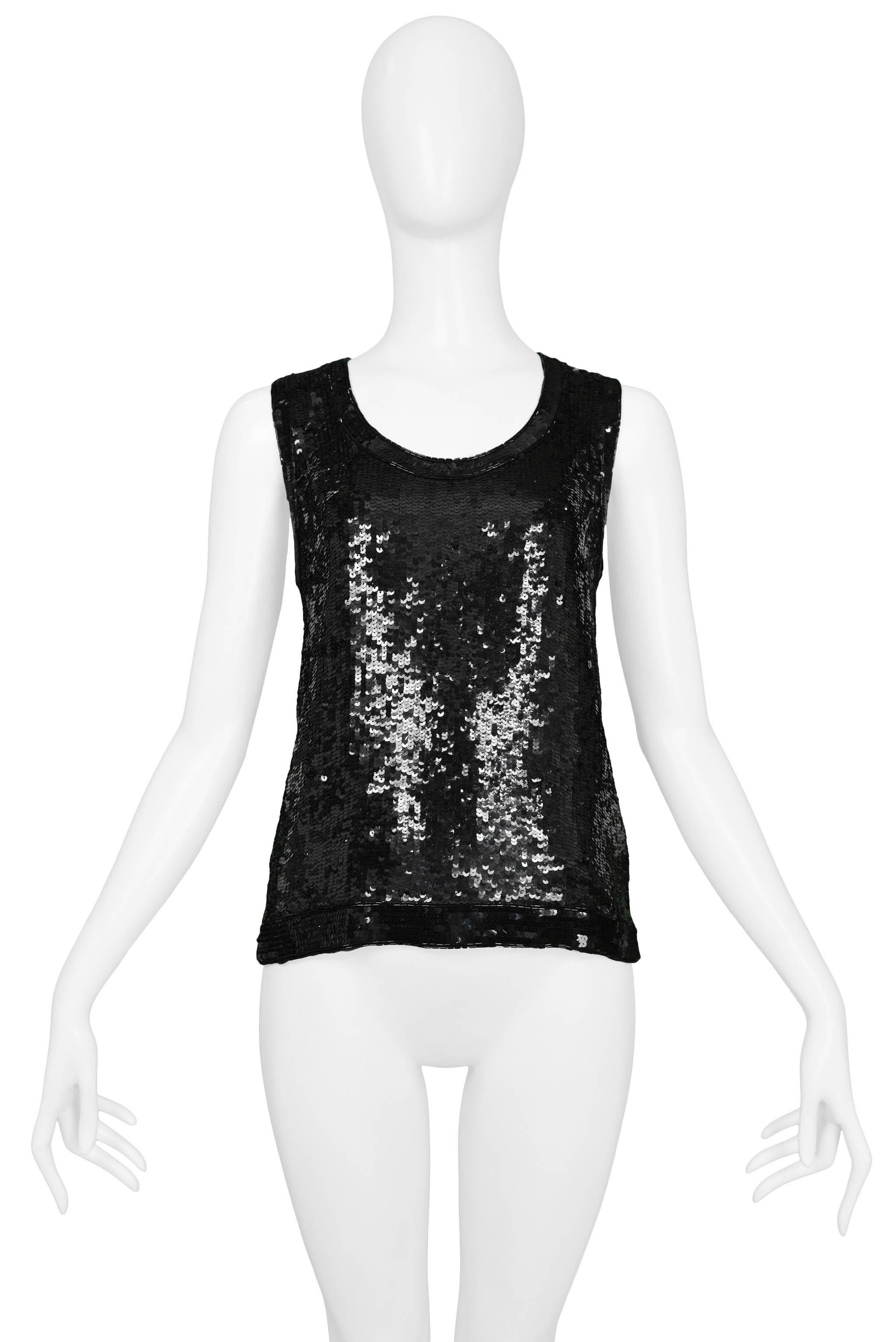 Resurrection Vintage is excited to offer a vintage Yves Saint Laurent black sequin and beaded tank top with contrasting black trim sequins at the neckline, armholes, and hem. 

Yves Saint Laurent
Measurements: Shoulder 13,