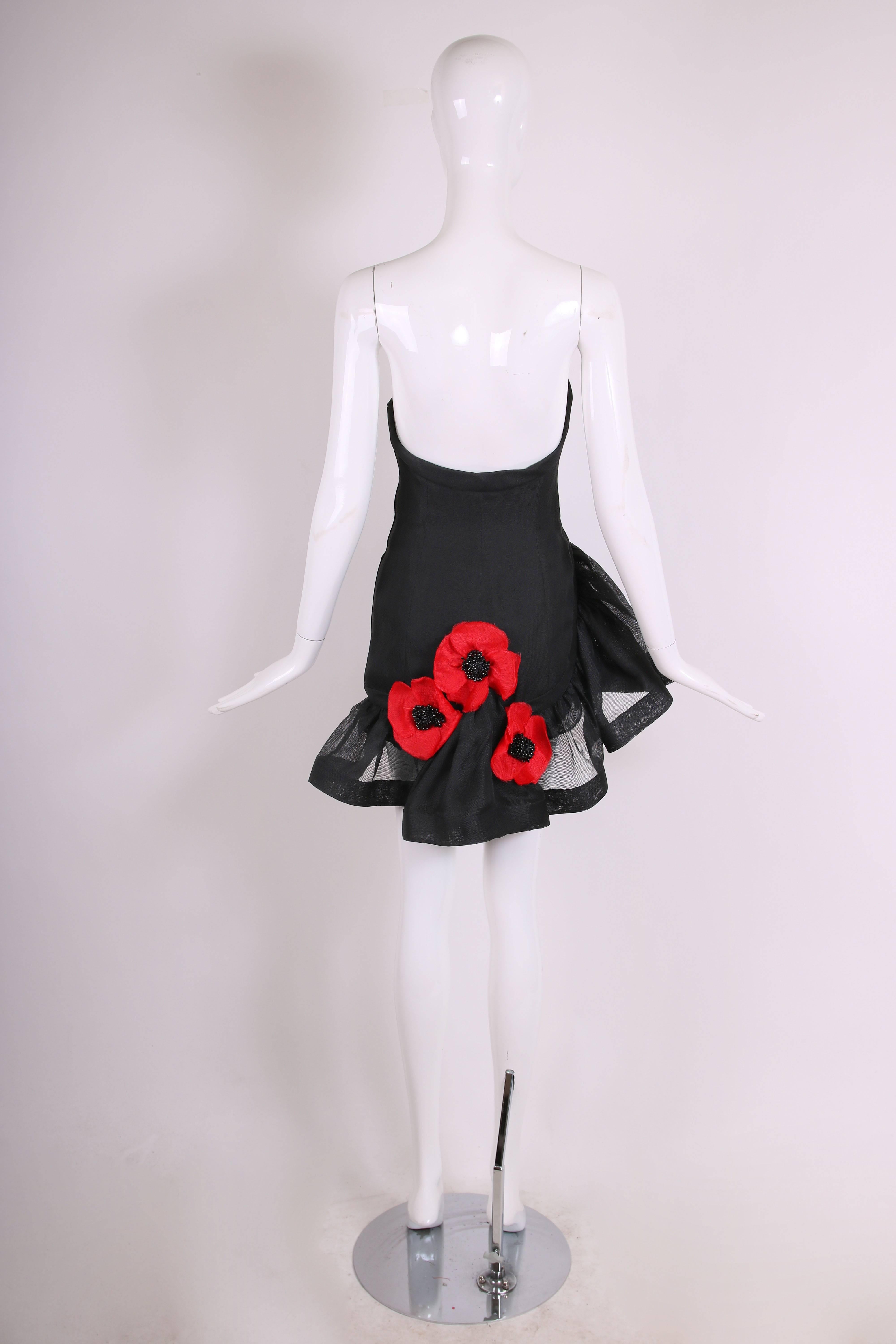 1990's Yves Saint Lauren YSL black gazar mini cocktail dress w/asymmetric strapless bust and asymmetric ruffled hem with oversized, red poppies at back. Interior boning at bust and silk lining. In excellent condition. Size 36
MEASUREMENTS:
Waist -