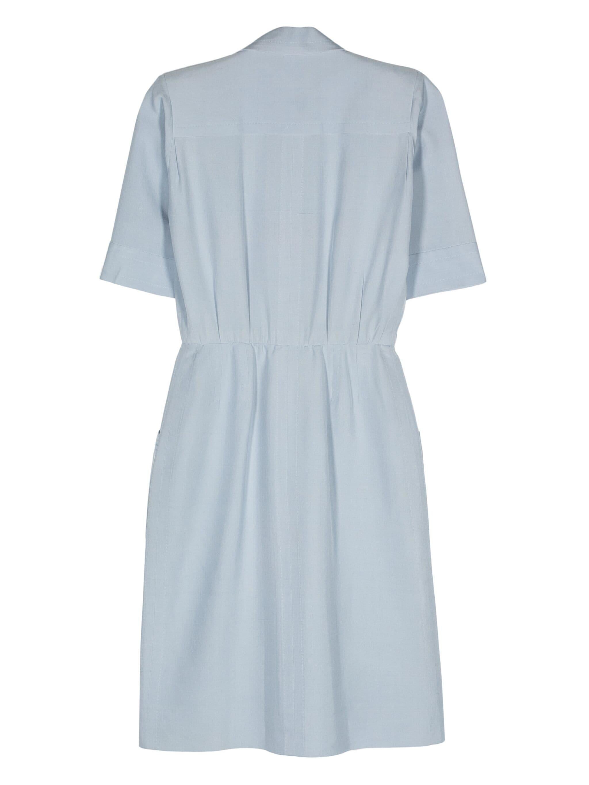 Yves Saint Laurent YSL blue silk dress featuring a shirt dress shape, fitted at the waist, front buttons, small shoulder pads, front patched pockets.
Circa 1990's
Composition: 6100% silk
Estimated size 38fr/US6 /UK10
Made in France. 
In good vintage