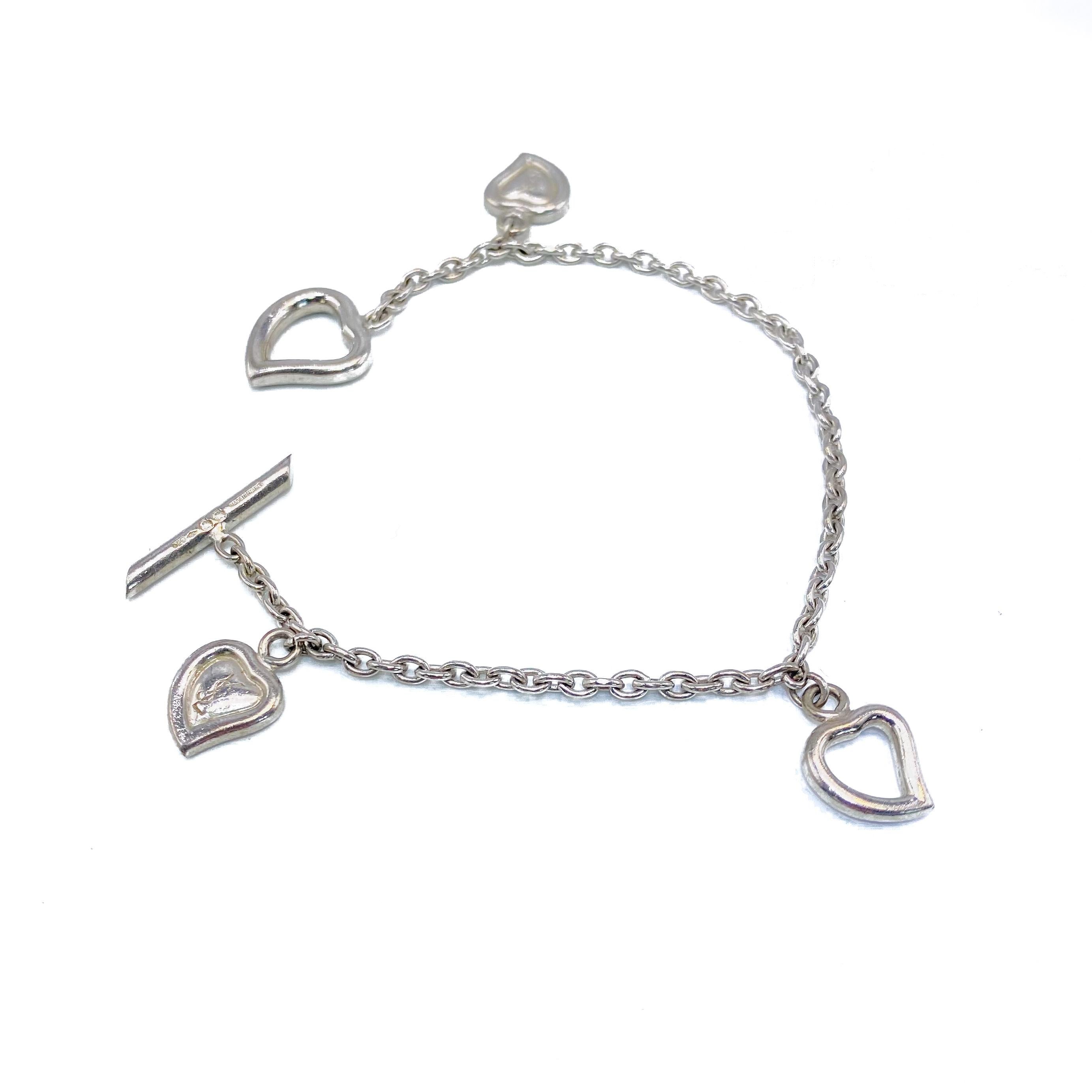 Yves Saint Laurent Vintage 1990s Silver Chain Bracelet

Beautifully delicate sterling silver piece from the House of Yves Saint Laurent Argent Collection

Detail
-Made in France in the 1990s
-Delicate sterling silver chain featuring four YSL shaped