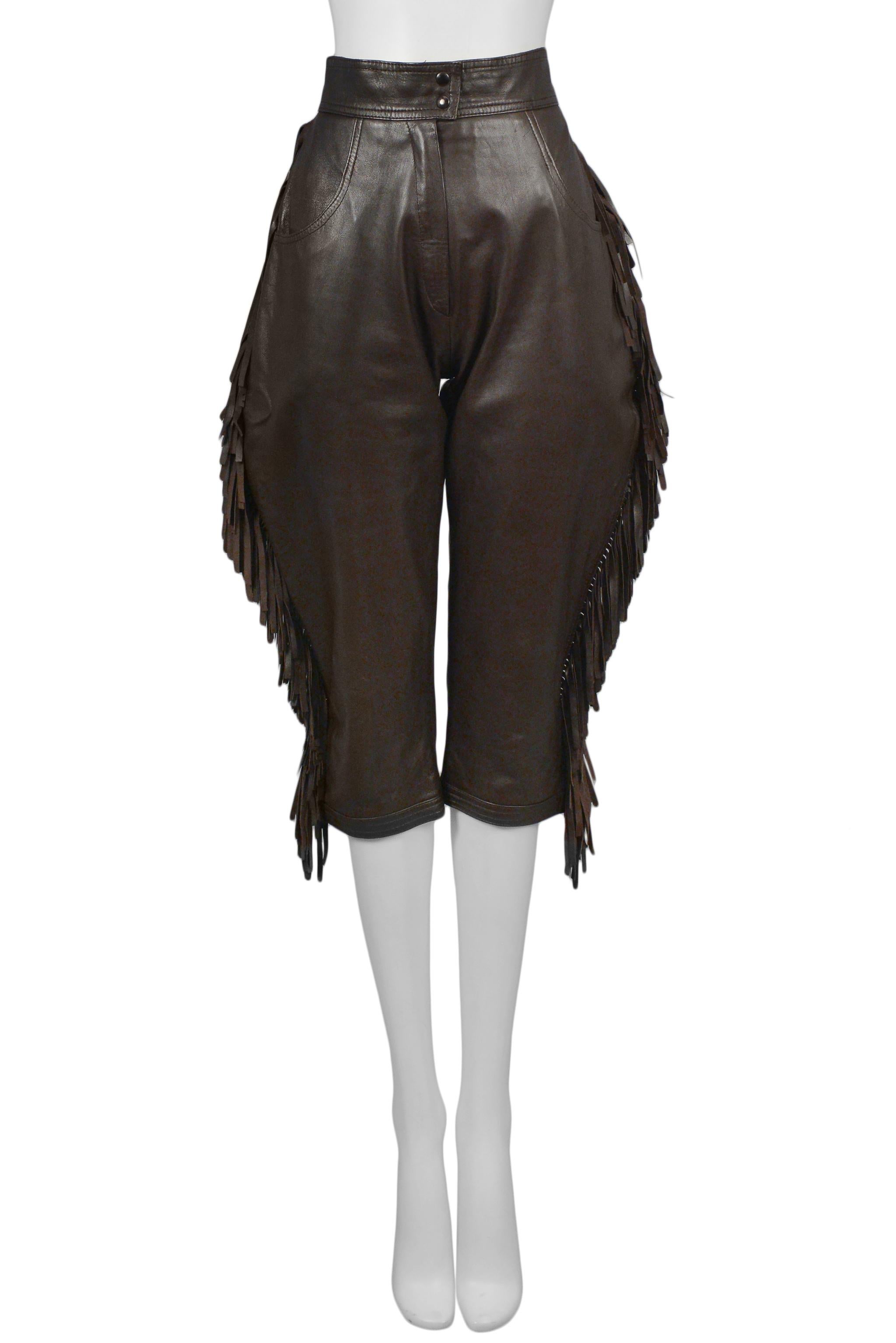 Resurrection Vintage is excited to present a pair of vintage Yves Saint Laurent brown leather knickers featuring fringe, jodhpur style, and cropped legs. 

Yves Saint Laurent
Size: Today's size 2 or 25.5