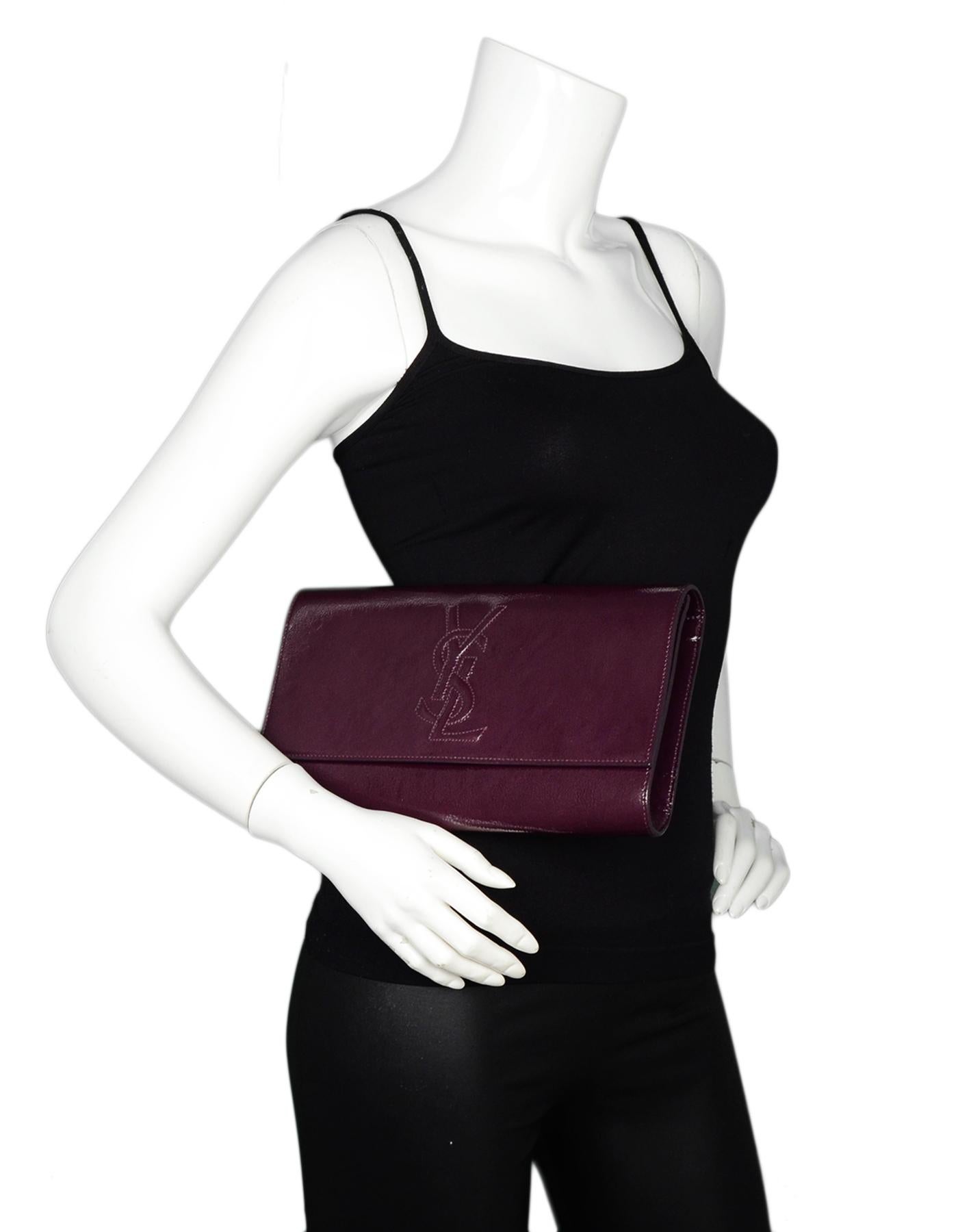 Yves Saint Laurent YSL Burgundy Belle DuJour Patent Leather Clutch 

Made In: Italy
Color: Burgundy 
Hardware: Goldtone
Materials: Patent leather
Lining: Burgundy satin
Closure/Opening: Flap top with magnetic closure
Exterior Pockets: None
Interior