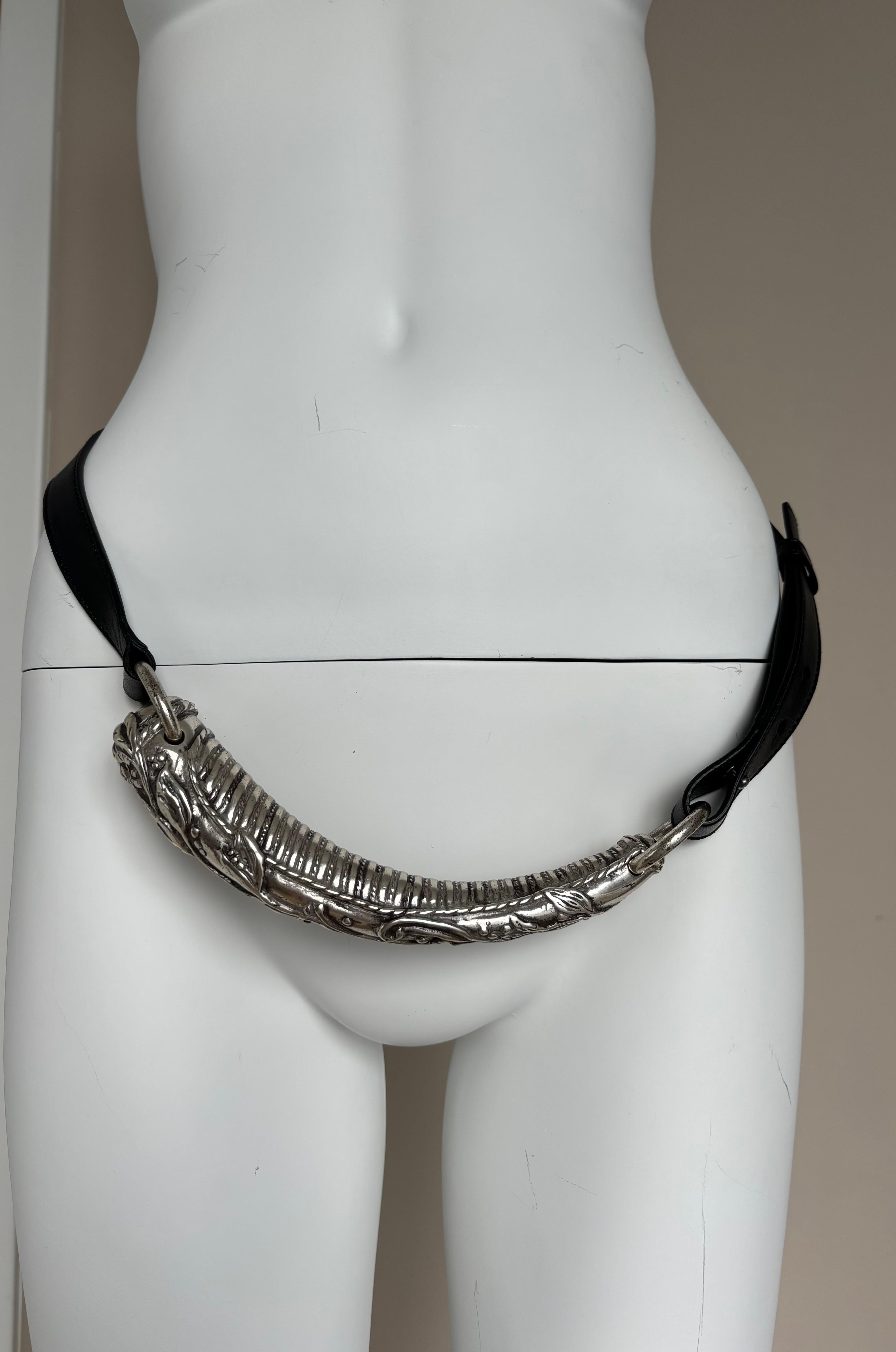 Tom Ford for Yves Saint Laurent
Rive Gauche
Vintage
2002
Silver Metal with Jet Black Leather
Excellent Condition, no flaws, looks unworn

The shortest you can wear the belt is at 36