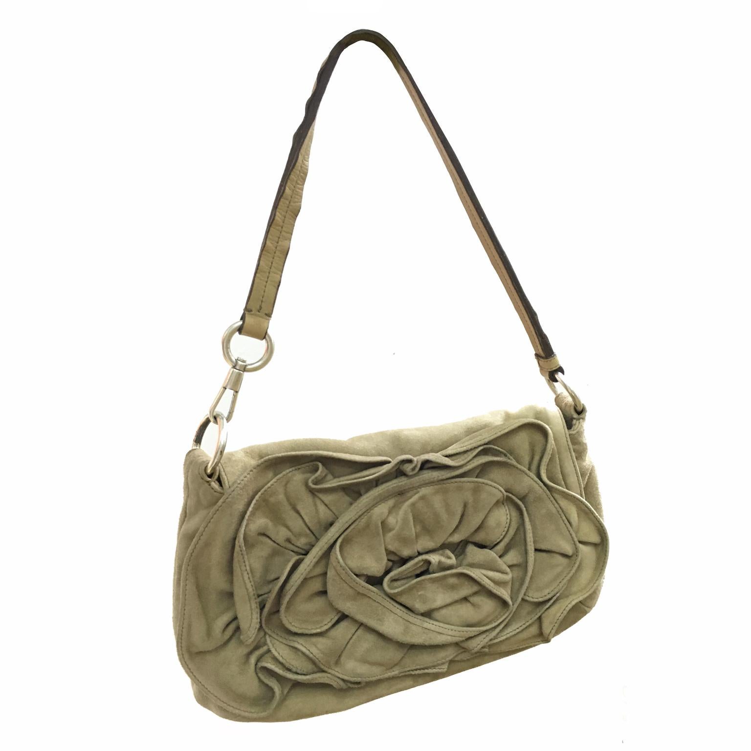 Yves Saint Laurent by Tom Ford, Nadja large rose suede shoulder bag.
Magnetic snap front closure, Silver tone hardware.
Interior features: One wall pocket with zipper closure 

Made In ITALY

Measurements :
Length 12