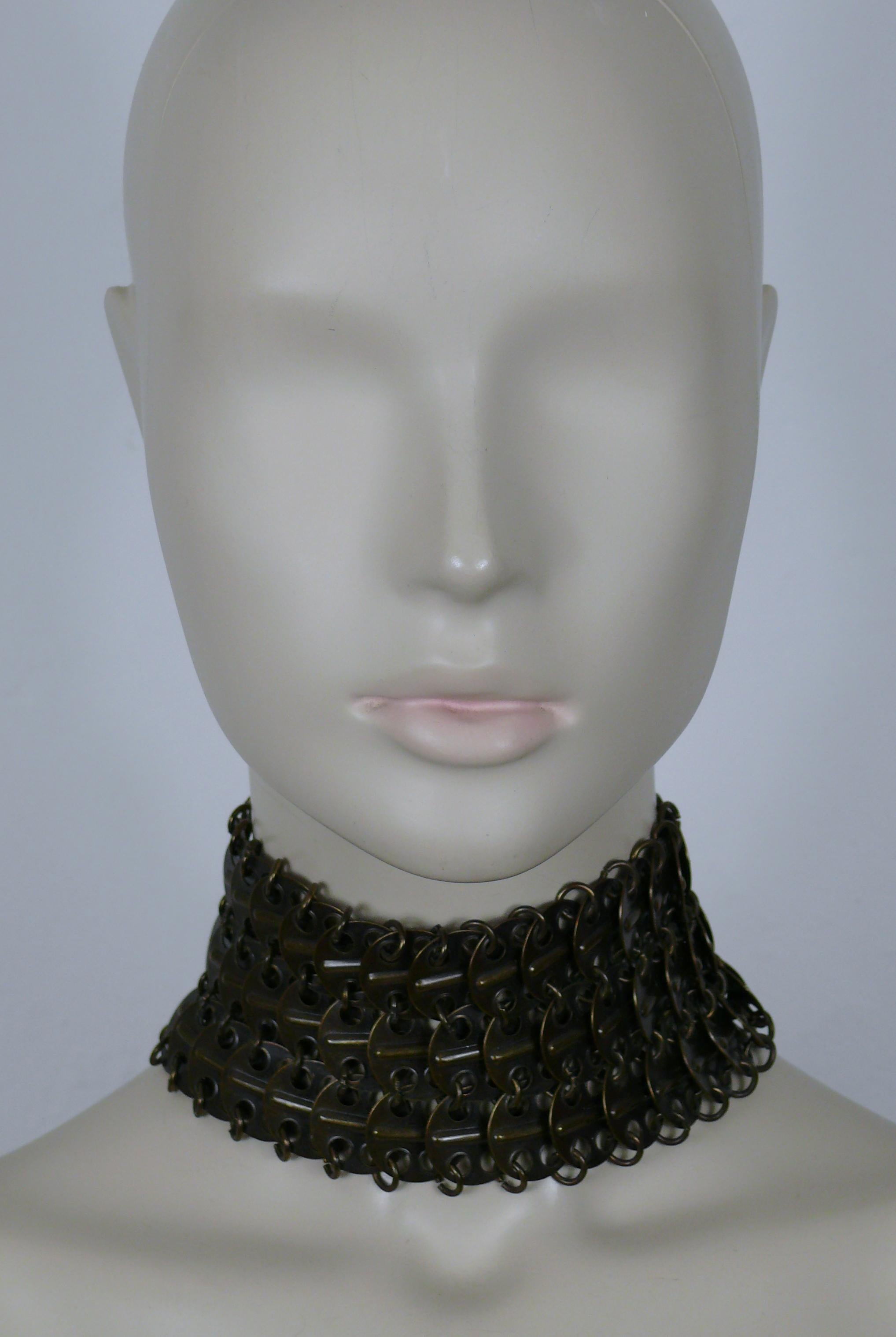YVES SAINT LAURENT antiqued bronze tone chainmail choker necklace.

Hook clasp closure.
Adjustable length.

YSL logo charm.

Indicative measurements : adjustable length from approx. 33 cm (12.99 inches) to approx. 40 cm (15.55 inches) / width