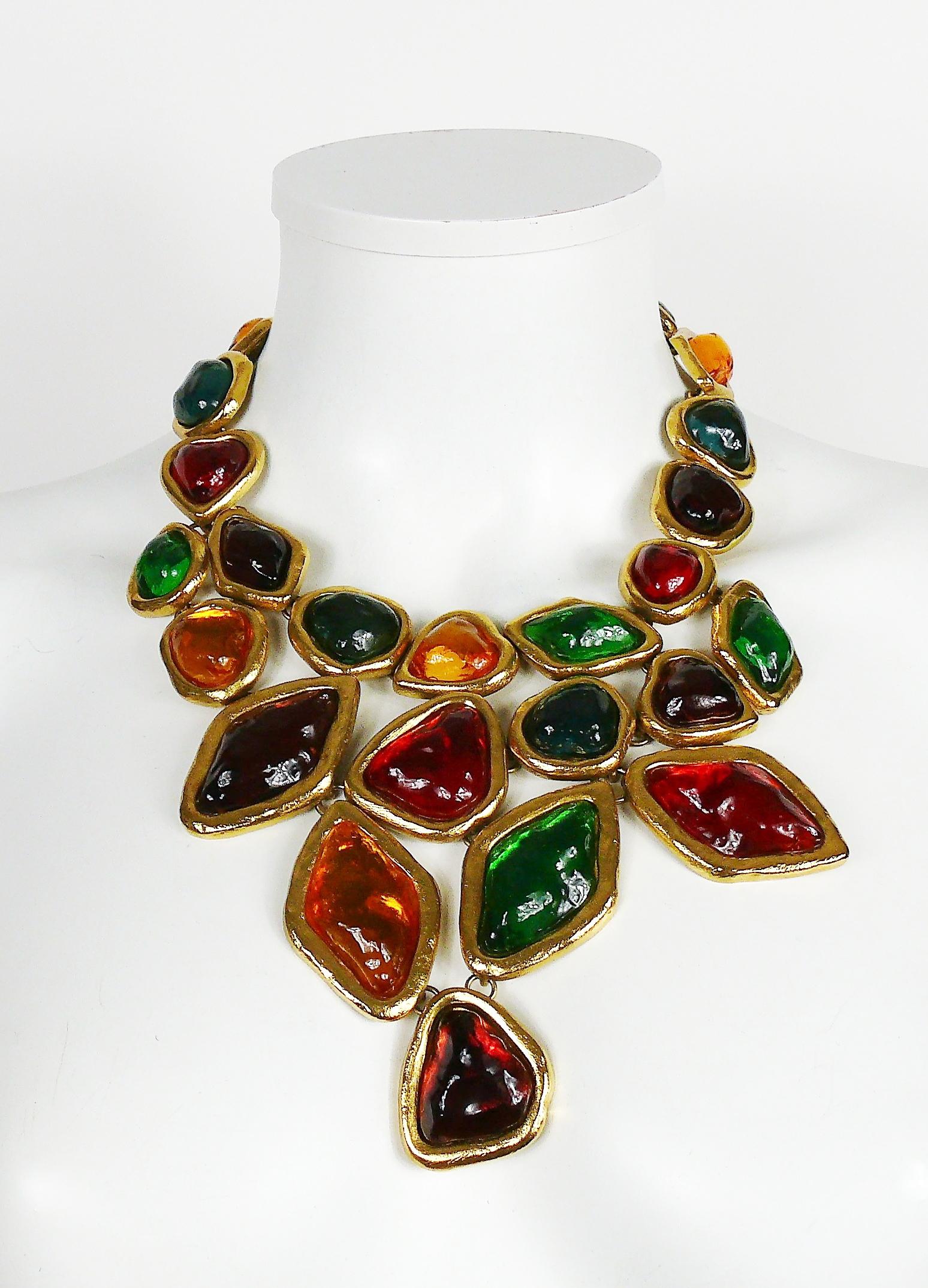 YVES SAINT LAURENT dramatic multi jewelled plastron necklace and earring set featuring vibrant multi colour poured resin stones and cabochons in a gold toned setting.

One of the most amazing YVES SAINT LAURENT costume jewelry set