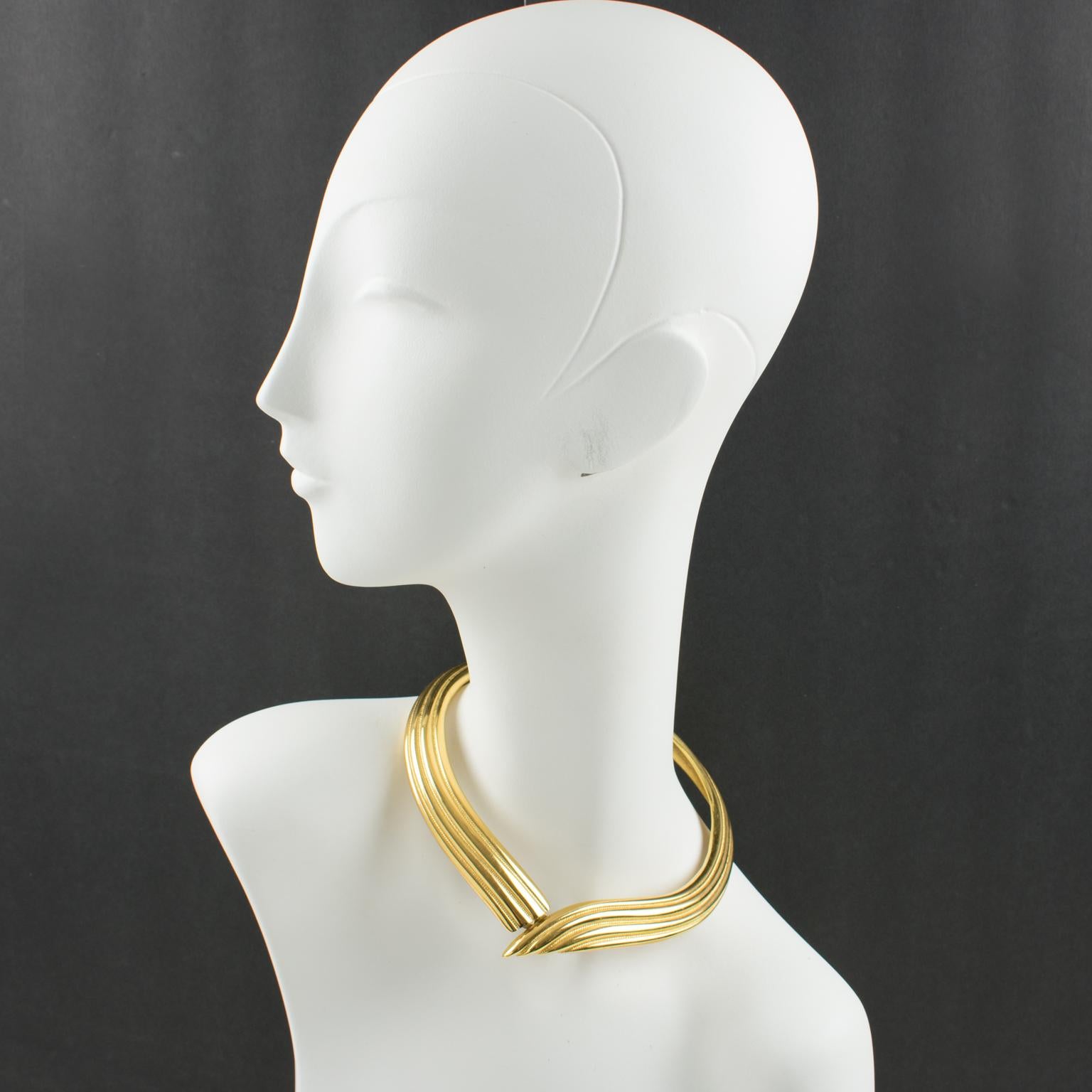 Stunning Yves Saint Laurent Paris collar necklace. Featuring gilt metal articulated rigid neckband with metal all textured. Modernist design with a hidden fastening system. Signed underside with 