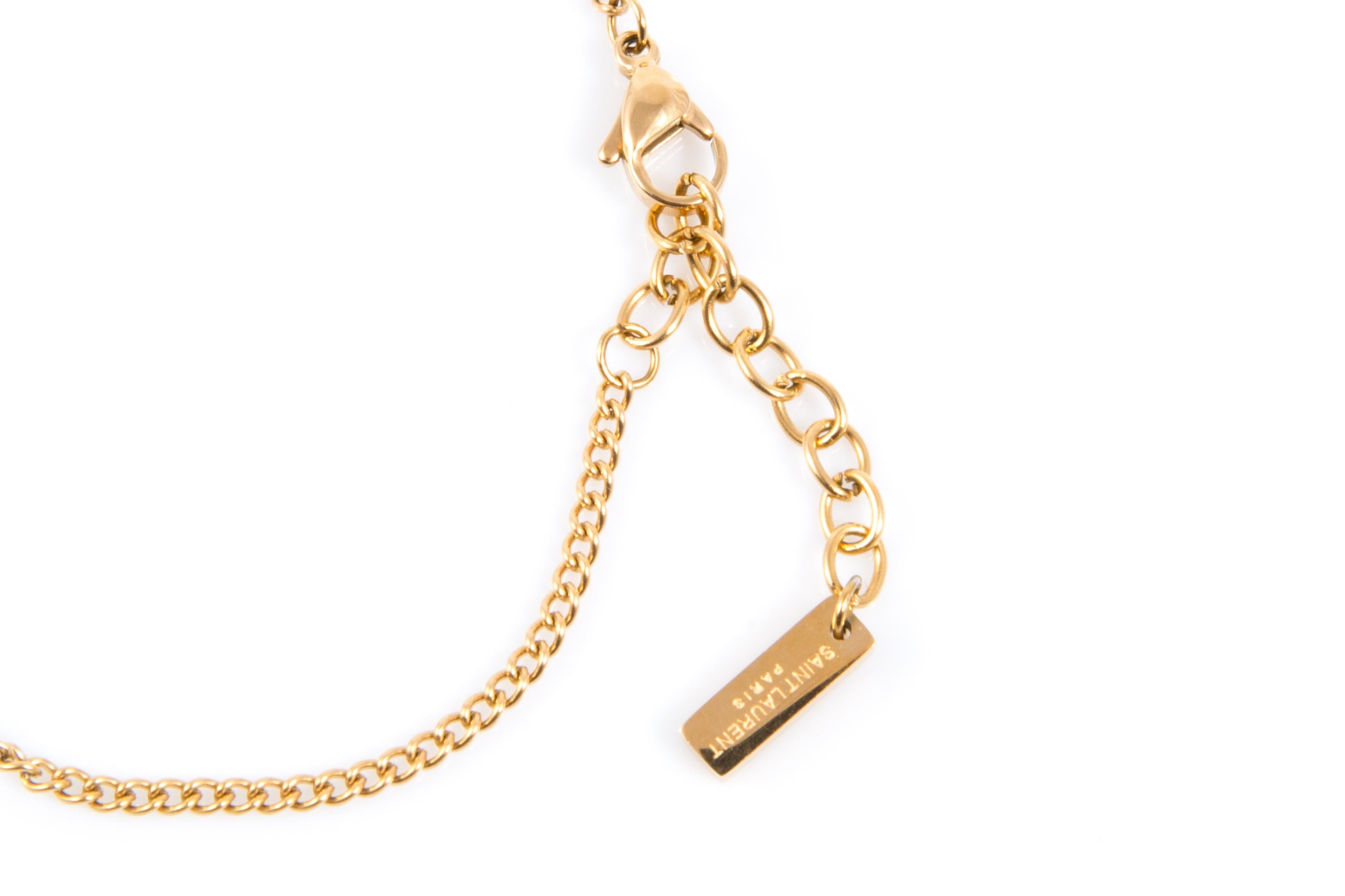 Yves Saint Laurent Yves Saint Laurent Cassandre bracelet en or Bon état - En vente à Paris, FR