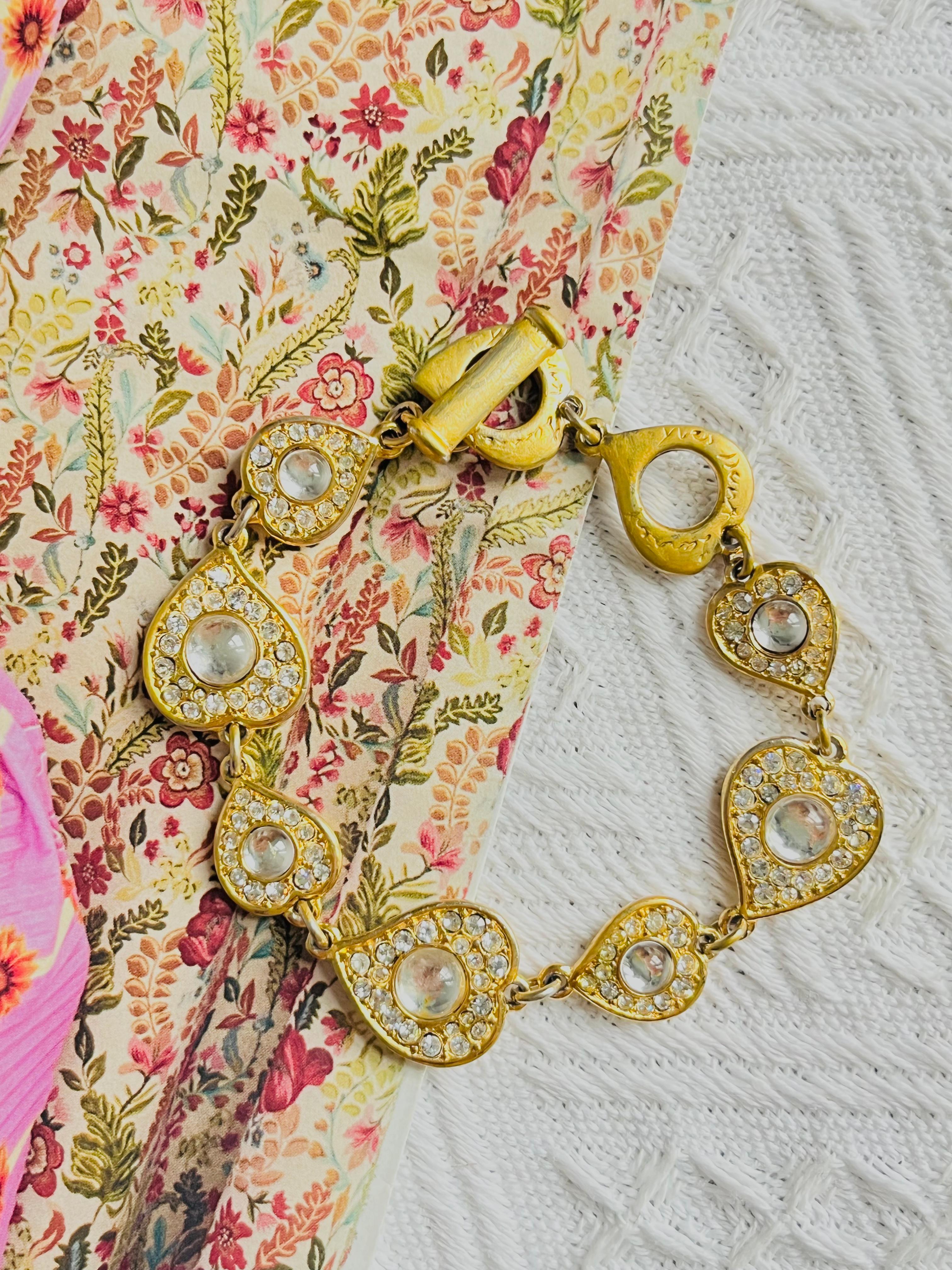 Yves Saint Laurent YSL Vintage 1980s Arty Gripoix Clear Crystals Hearts Love Interlinked Bracelet, Gold Tone

Very good condition. Light scratches or colour loss at clasp. 

Very good to wear. 100% genuine. Rare to find.

Toggle and loop closure