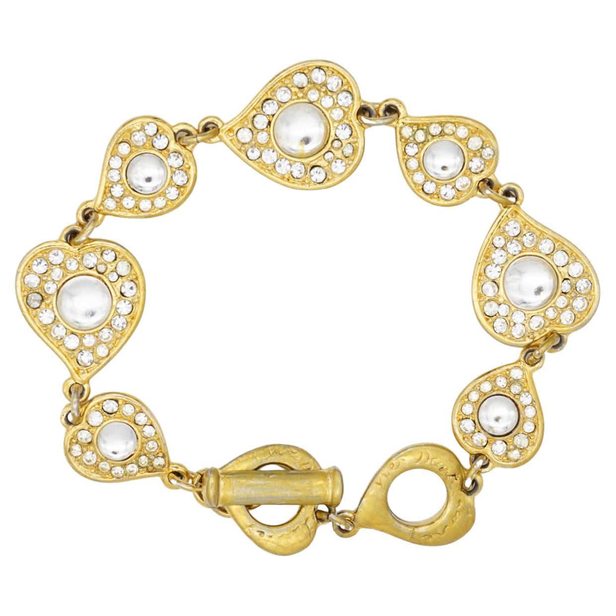 Yves Saint Laurent YSL Vintage 1980s Arty Gripoix Clear Crystals Hearts Love Interlinked Elegant Bracelet, Gold Tone

Very good condition. Light scratches or colour loss at clasp. Very good to wear. 100% genuine. Rare to find.

Toggle and loop