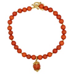 Collana Yves Saint Laurent YSL Haute Couture con cabochon iconico rosso corallo-arancio