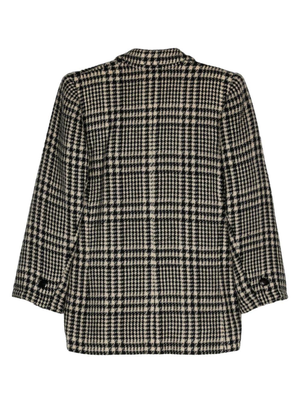 YSL Yves Saint Laurent Houndstooth blazer featuring an houndstooth pattern, notched lapels, front button fastening, long sleeves, two front patch pockets. 
Composition: Wool 100%
Circa 1980s
Label size 38fr/US6 /UK10
In good vintage condition. Made